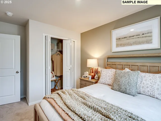 a bedroom with a bed and wall painting