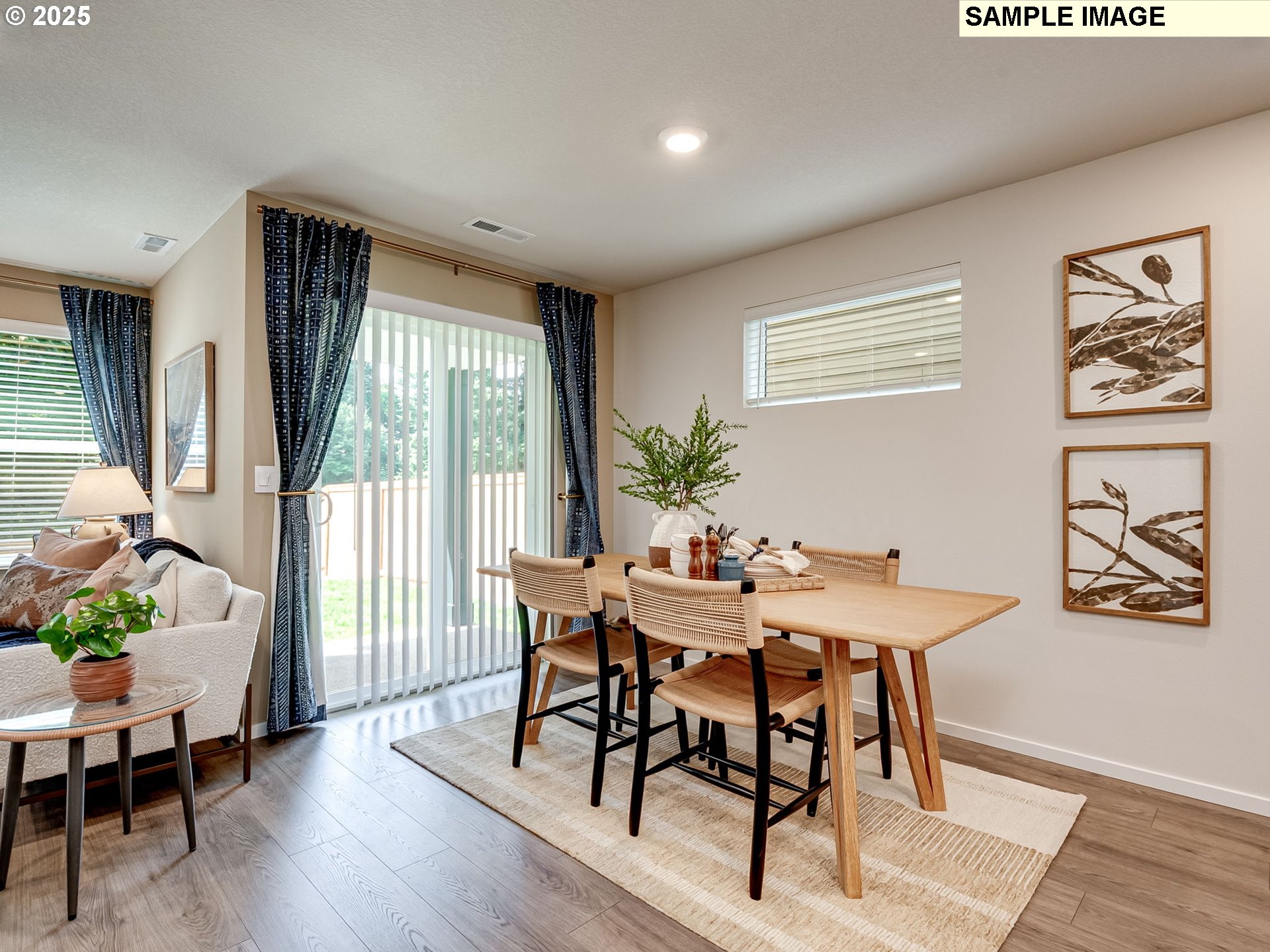 11118 Southeast Maxon Road Vancouver, WA 98664 - Photo 9 of 31 a view of a dining room with furniture window and wooden floor