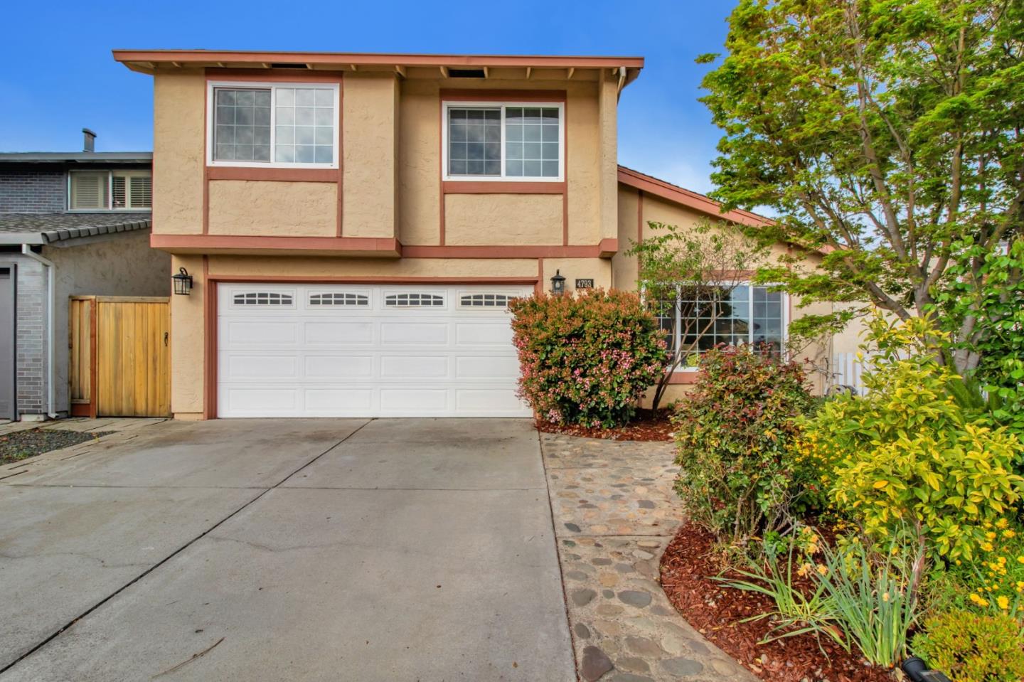 4793 Corte De Cervato San Jose, CA 95136 - Photo 1 of 45 a front view of a house with garden