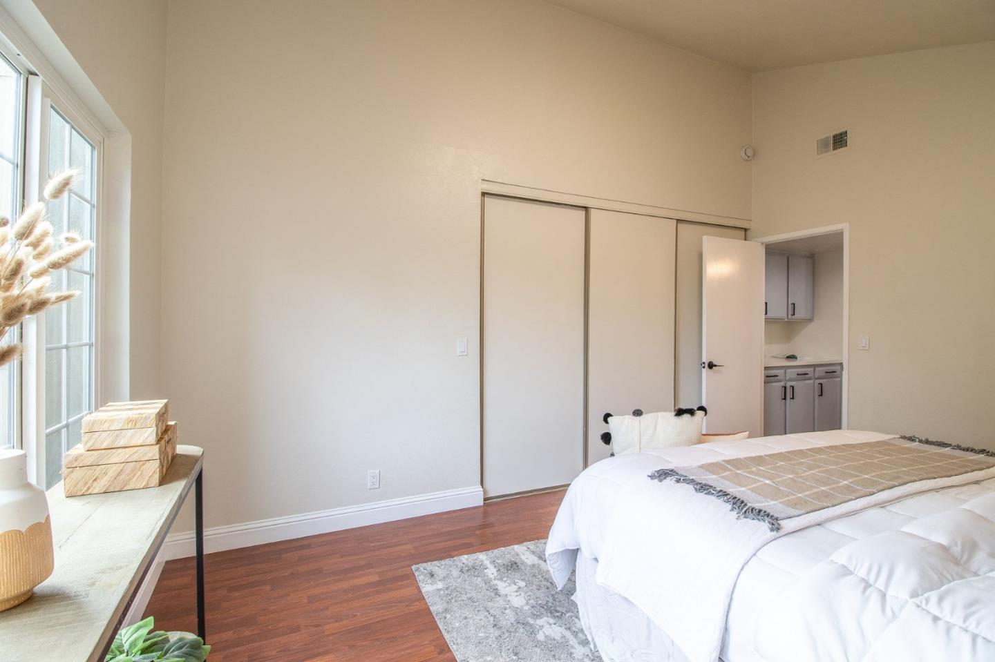 4793 Corte De Cervato San Jose, CA 95136 - Photo 12 of 45 a spacious bedroom with a bed and a window
