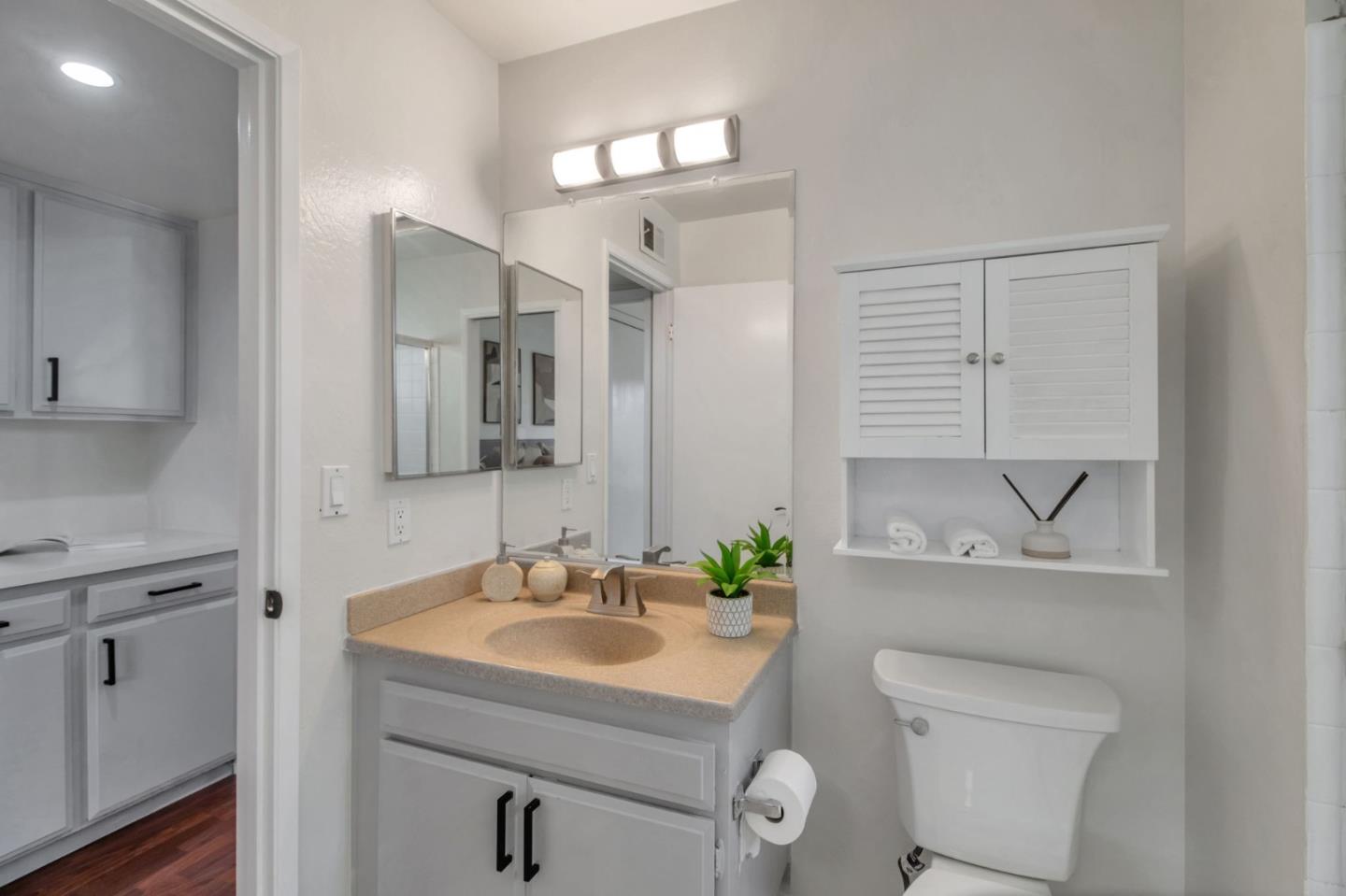 4793 Corte De Cervato San Jose, CA 95136 - Photo 15 of 45 a bathroom with a sink toilet and mirror