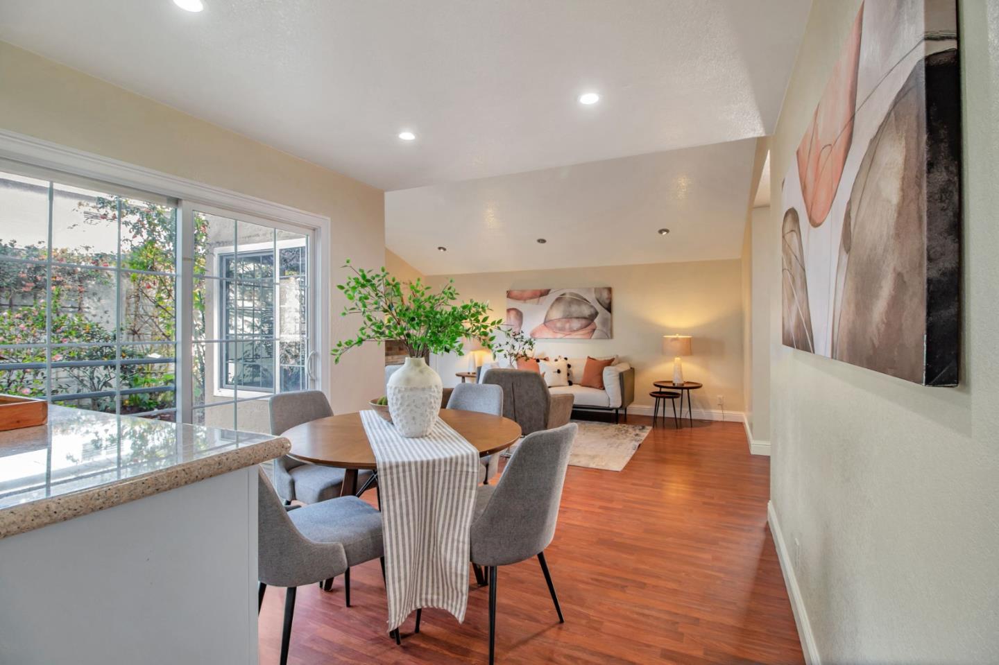 4793 Corte De Cervato San Jose, CA 95136 - Photo 19 of 45 a view of a dining room with furniture window and wooden floor