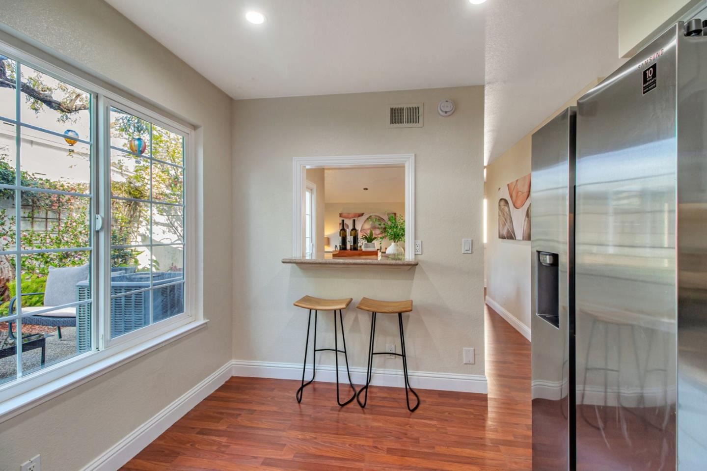 4793 Corte De Cervato San Jose, CA 95136 - Photo 21 of 45 a view of a hallway with wooden floor and a living room