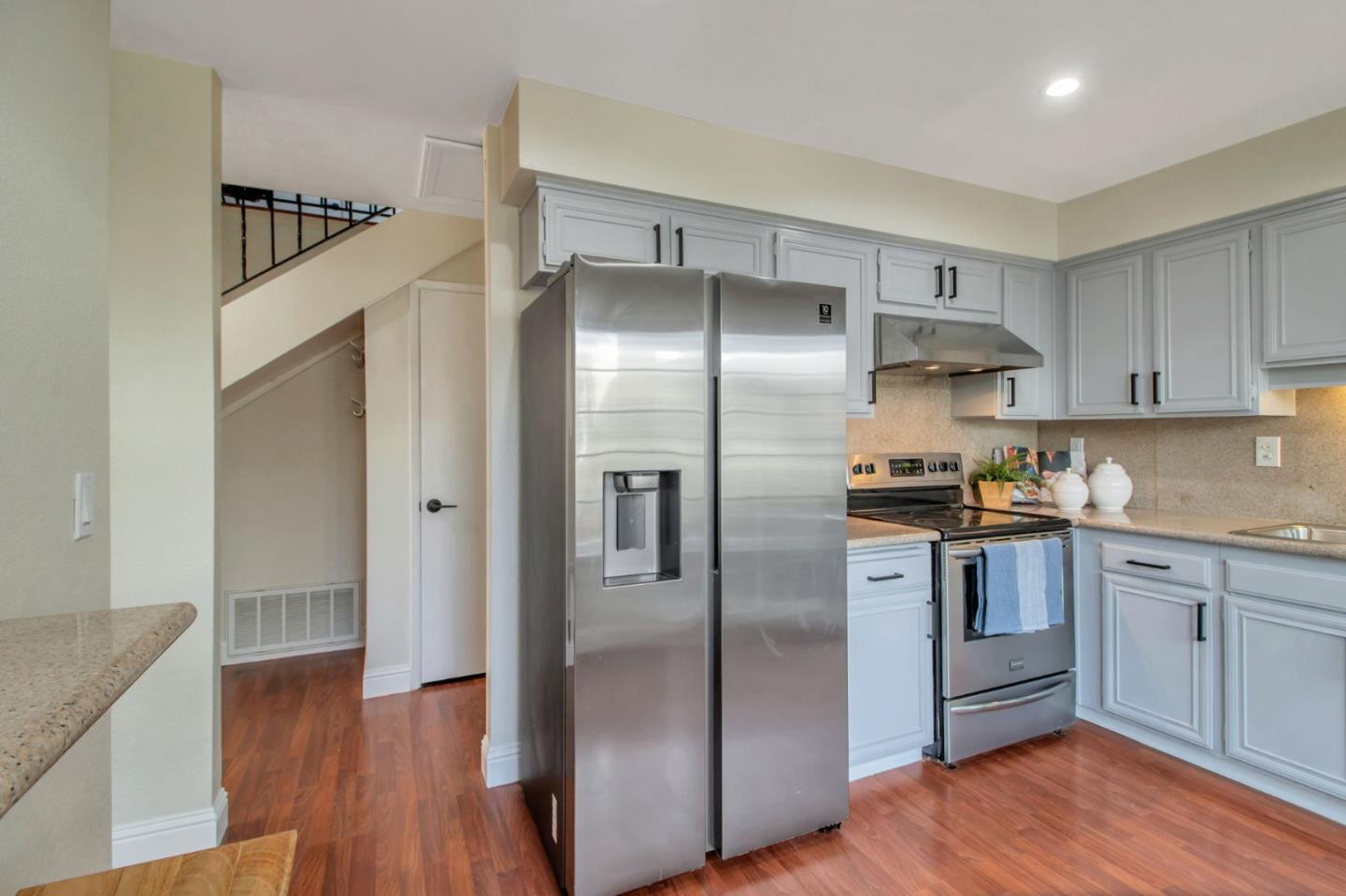 4793 Corte De Cervato San Jose, CA 95136 - Photo 25 of 45 a kitchen with granite countertop a refrigerator and a sink