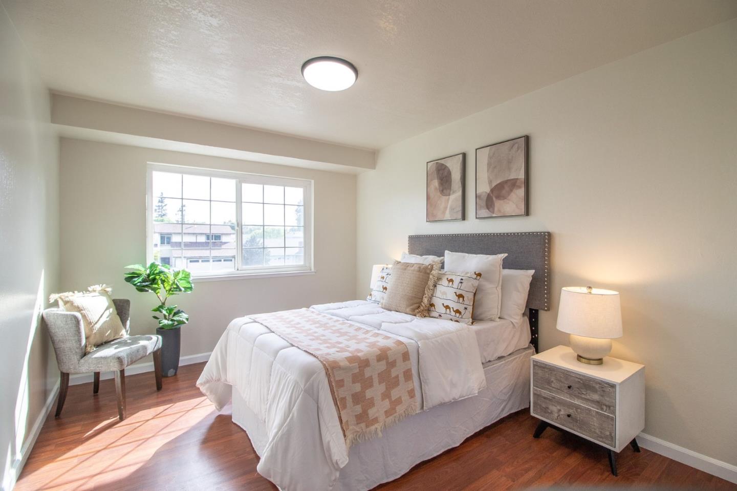 4793 Corte De Cervato San Jose, CA 95136 - Photo 31 of 45 a bedroom with a bed and a chair