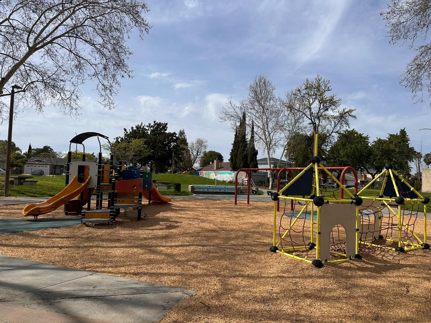 4793 Corte De Cervato San Jose, CA 95136 - Photo 40 of 45 a view of a park with swings and slides