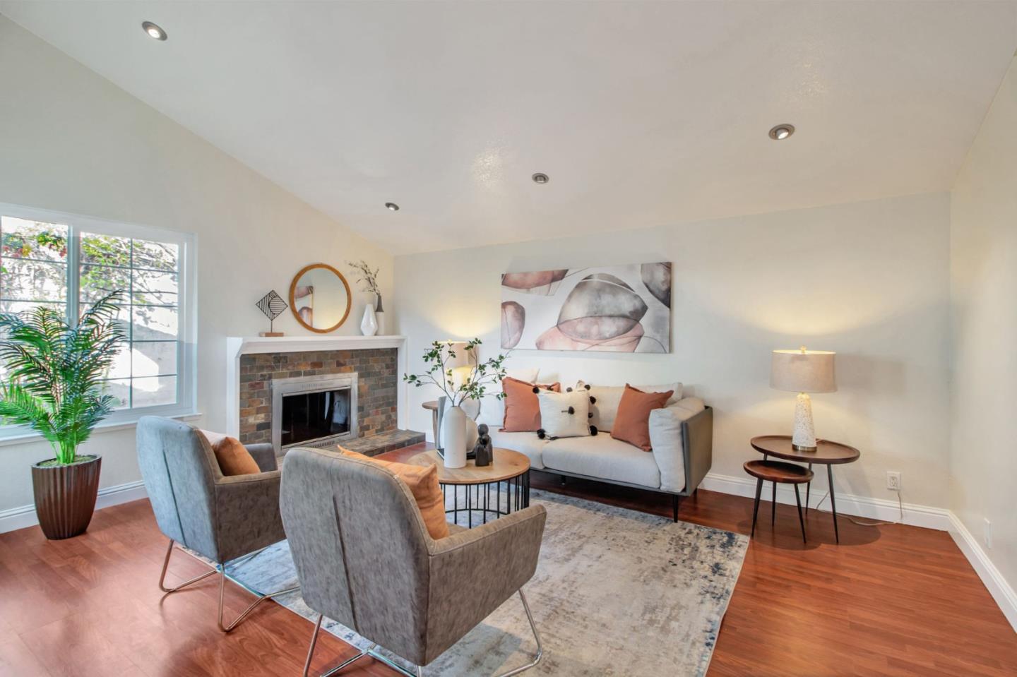 4793 Corte De Cervato San Jose, CA 95136 - Photo 8 of 45 a living room with furniture a fireplace and a potted plant