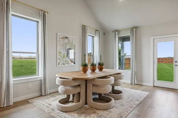 a dining room with furniture and window