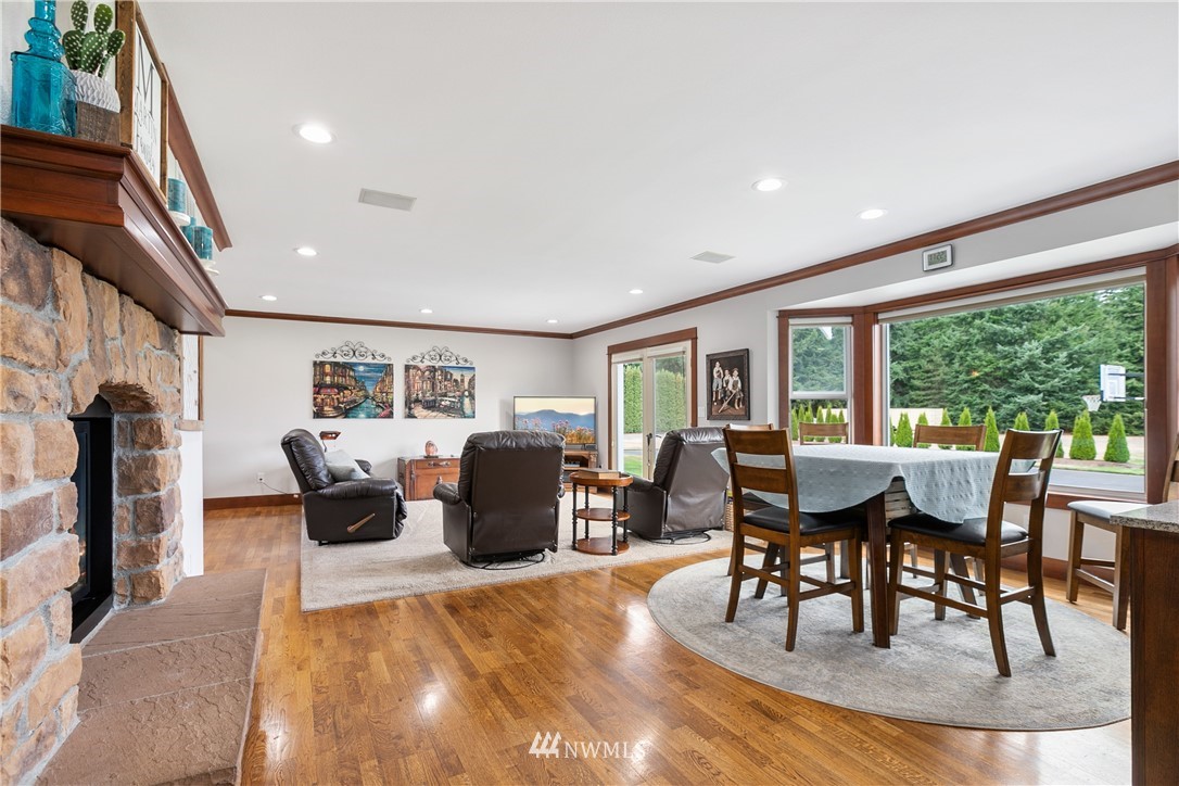 810 East Wiser Lake Road Lynden, WA 98264 - Photo 11 of 40 a view of a dining room with furniture window and wooden floor