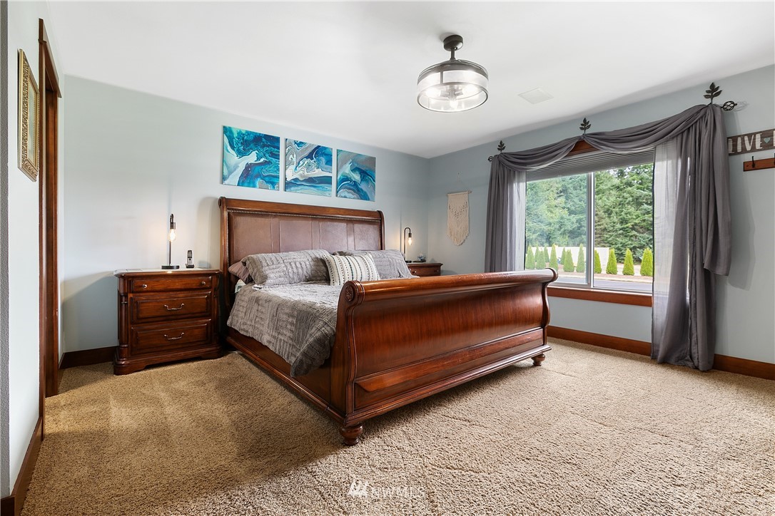 810 East Wiser Lake Road Lynden, WA 98264 - Photo 14 of 40 a bedroom with a bed and a window