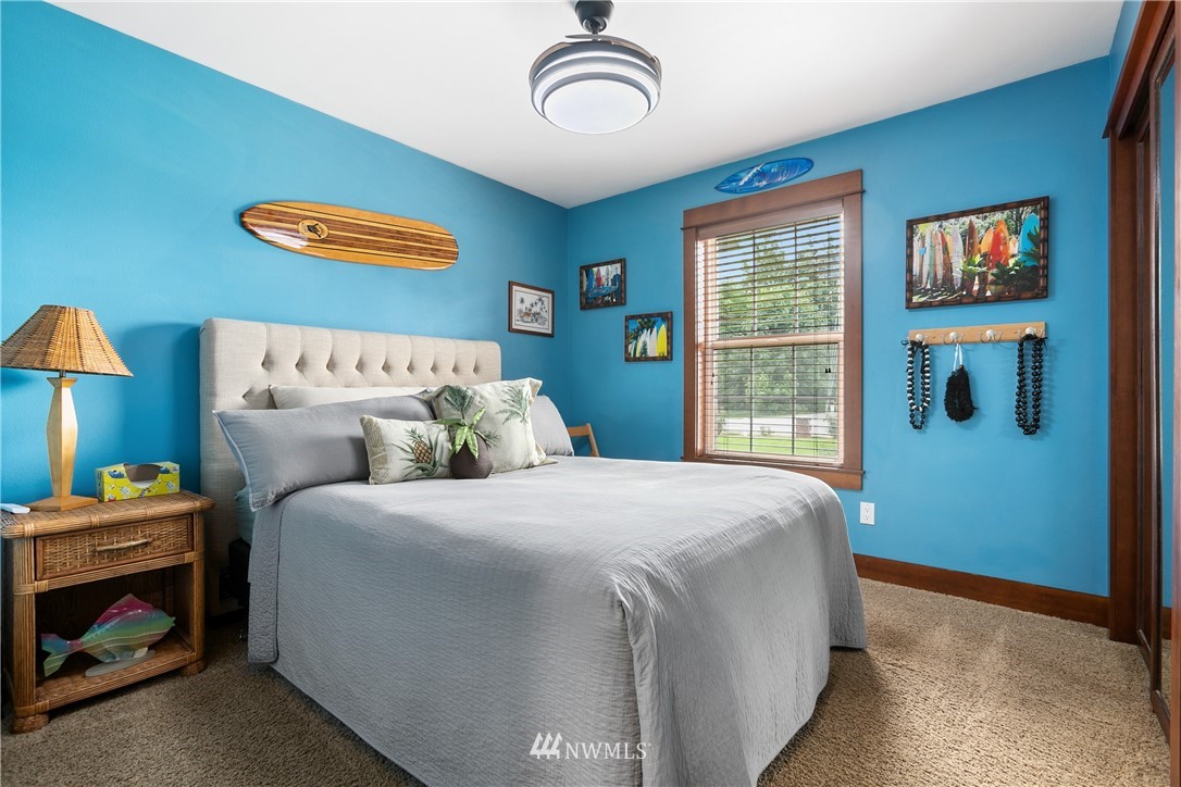 810 East Wiser Lake Road Lynden, WA 98264 - Photo 18 of 40 a bedroom with a bed and a window