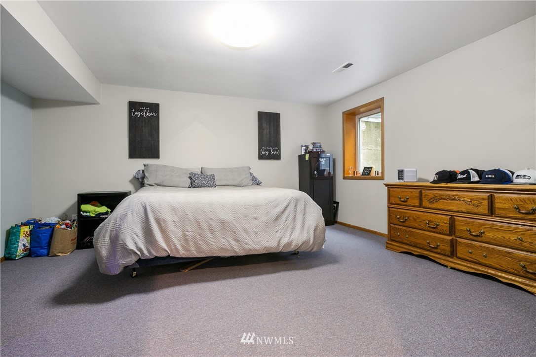 810 East Wiser Lake Road Lynden, WA 98264 - Photo 21 of 40 a bedroom with a bed and window