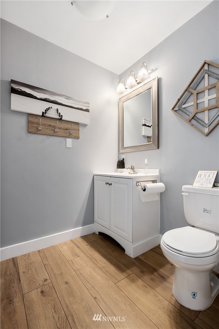 810 East Wiser Lake Road Lynden, WA 98264 - Photo 35 of 40 a bathroom with a toilet sink and mirror