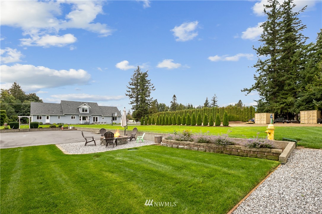 810 East Wiser Lake Road Lynden, WA 98264 - Photo 37 of 40 a view of a swimming pool and trees in the background