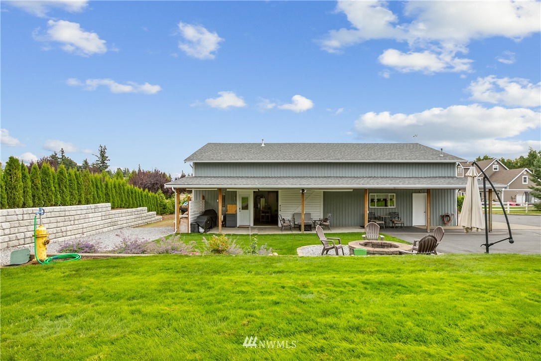 810 East Wiser Lake Road Lynden, WA 98264 - Photo 38 of 40 a front view of house with a garden and patio