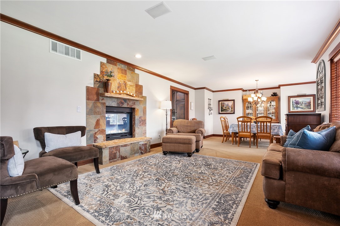 810 East Wiser Lake Road Lynden, WA 98264 - Photo 6 of 40 a living room with furniture wooden floor and a fireplace