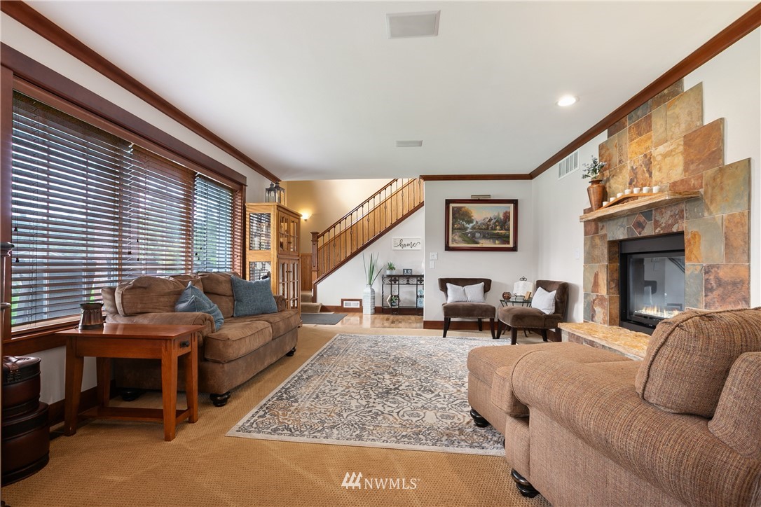 810 East Wiser Lake Road Lynden, WA 98264 - Photo 7 of 40 a living room with furniture window and a fireplace