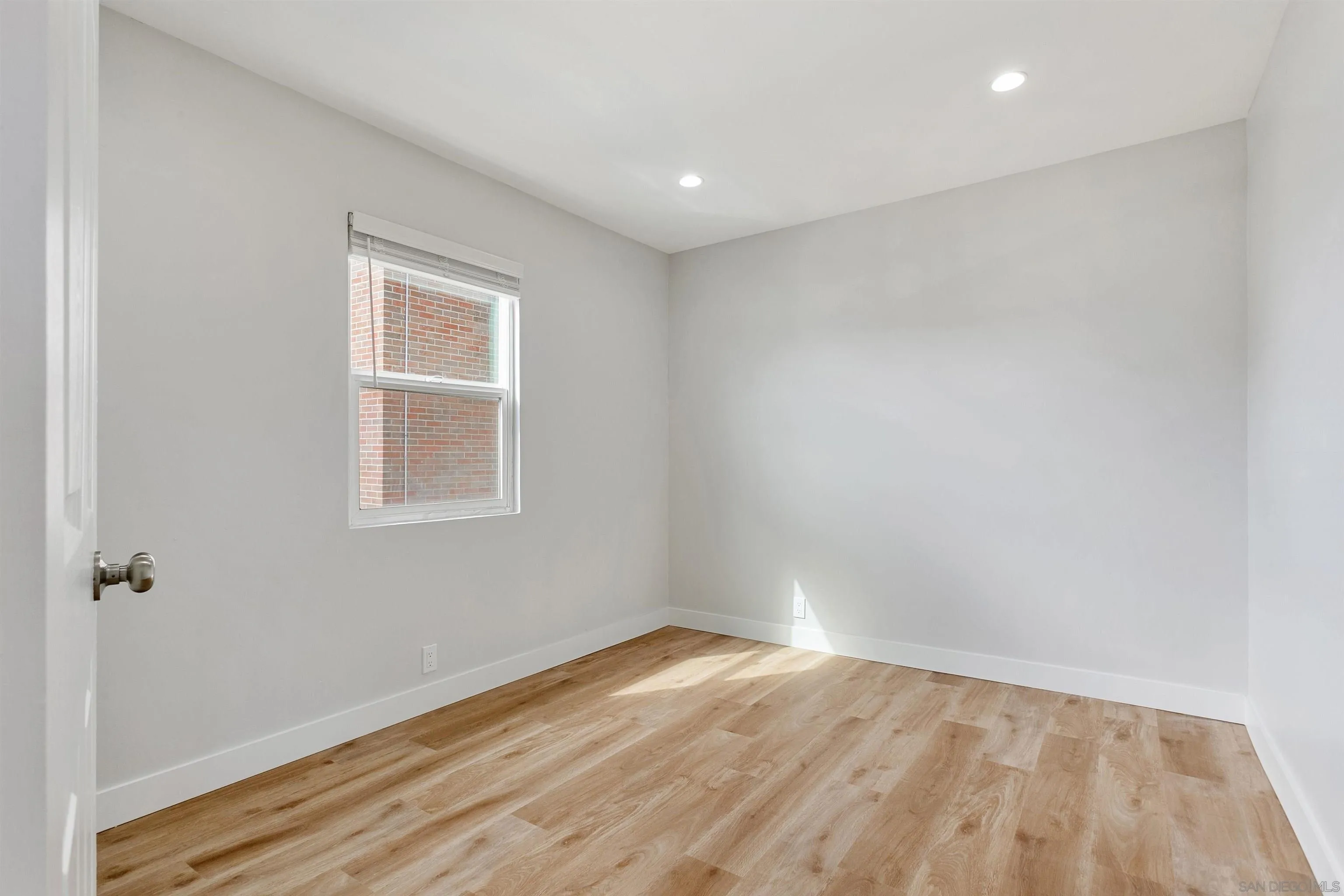 520 Pearl Street, Unit 2 La Jolla, CA 92037 - Photo 12 of 27 a view of empty room with wooden floor and fan