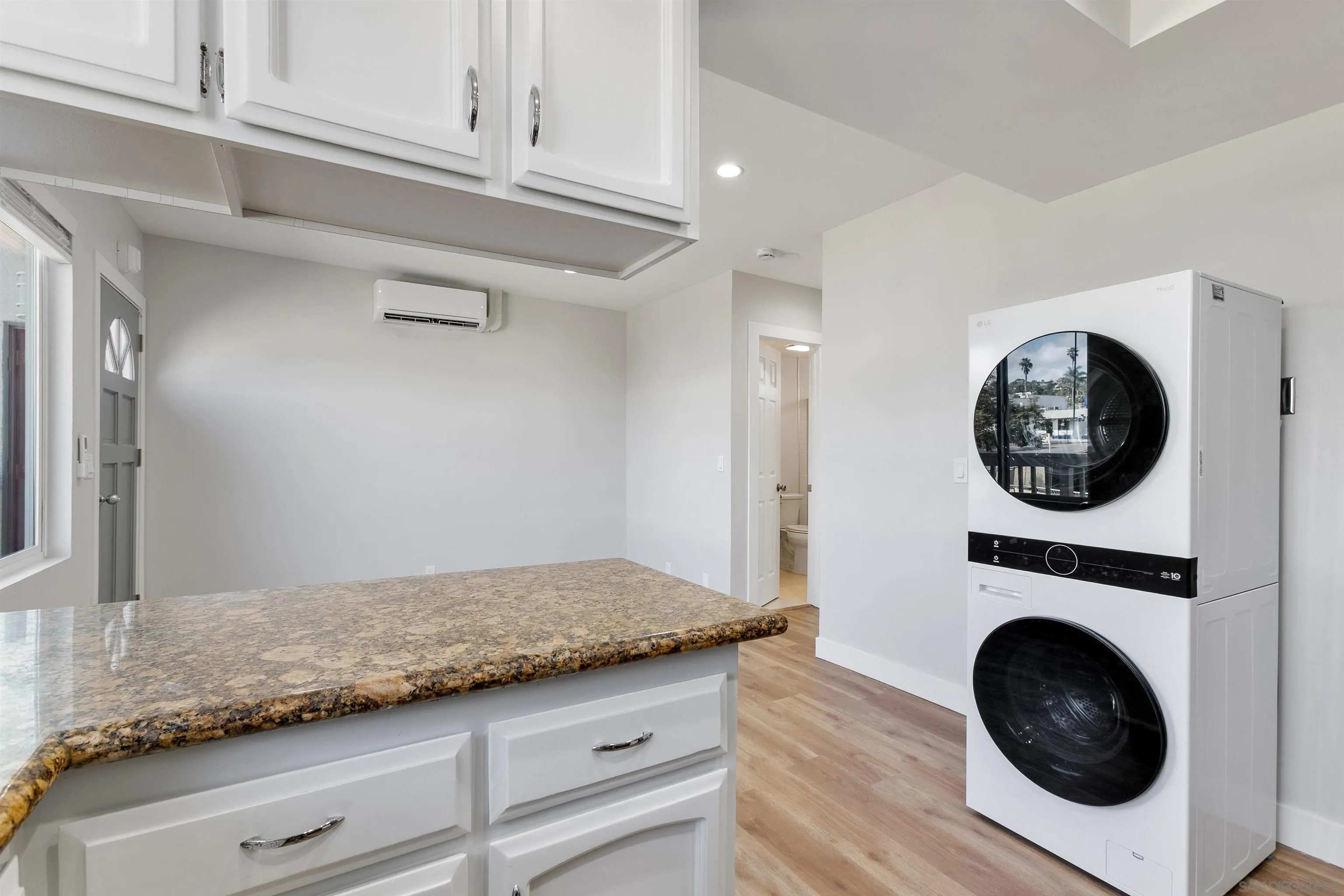 520 Pearl Street, Unit 2 La Jolla, CA 92037 - Photo 9 of 27 a view of a hallway with washer and dryer