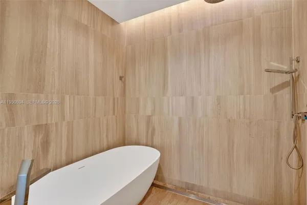 a bathroom with a white curtain and curtain