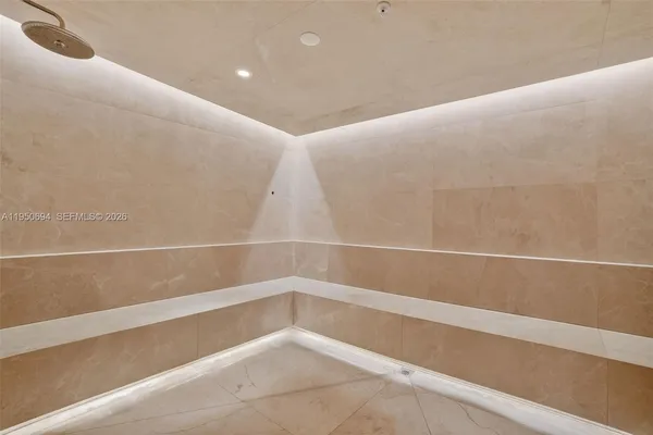 a living room with a bed furniture and a window