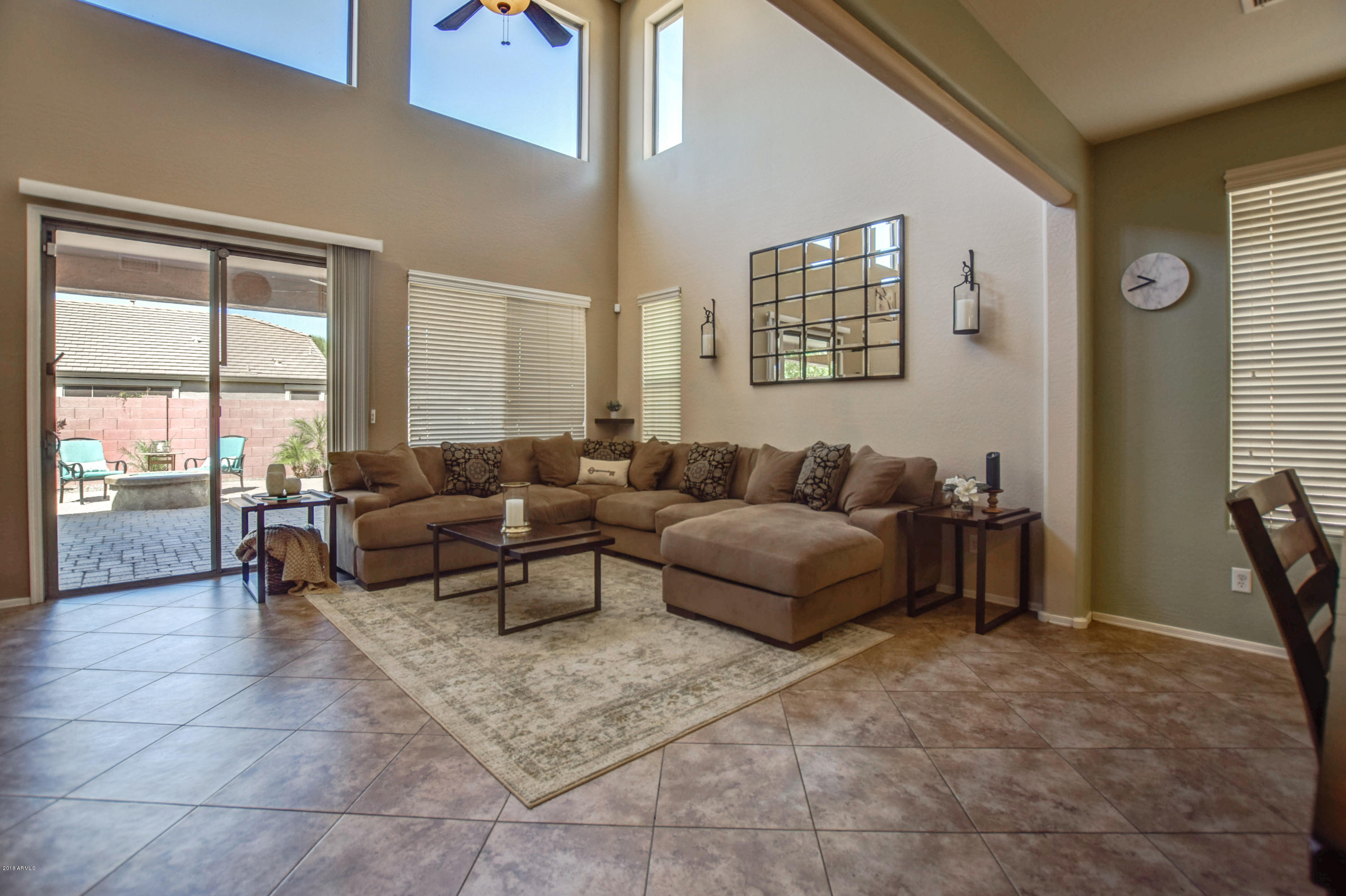 19702 East Thornton Road Queen Creek, AZ 85142 - Photo 15 of 79 a living room with furniture and a floor to ceiling window