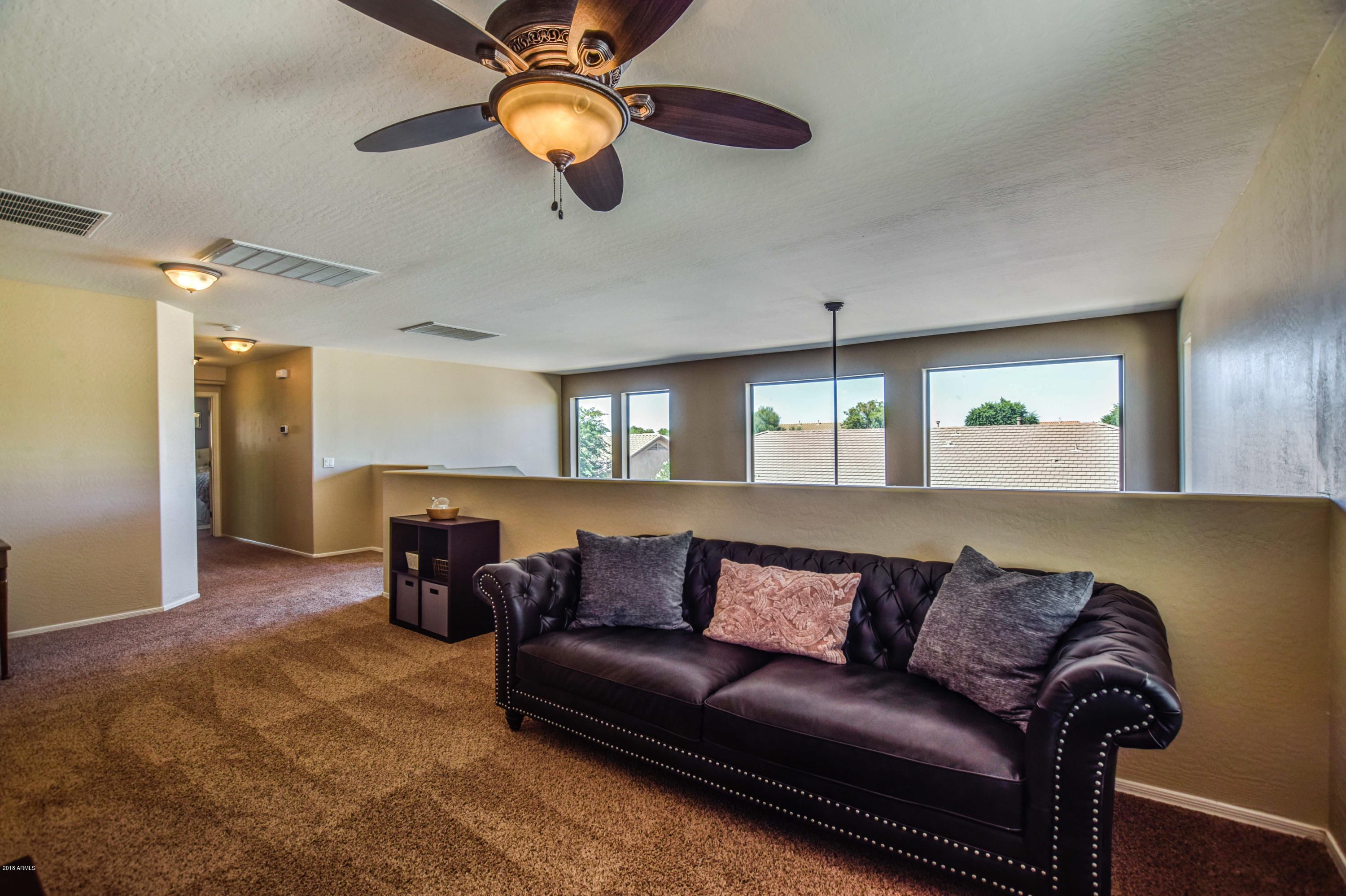 19702 East Thornton Road Queen Creek, AZ 85142 - Photo 31 of 79 a view of a livingroom with furniture and chandelier fan