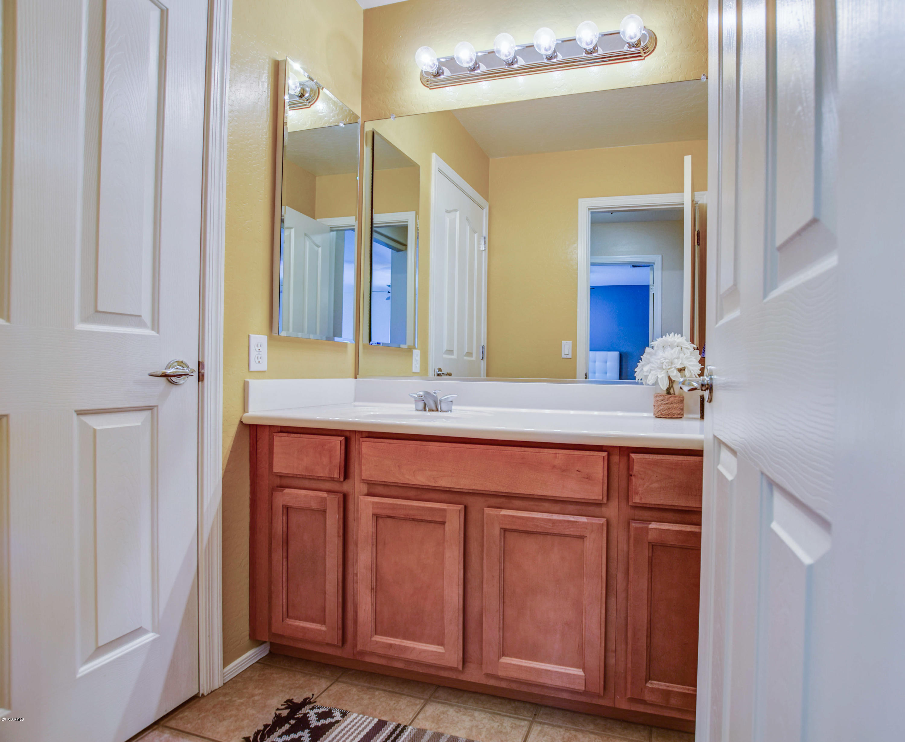 19702 East Thornton Road Queen Creek, AZ 85142 - Photo 49 of 79 a bathroom with a granite countertop sink and a mirror