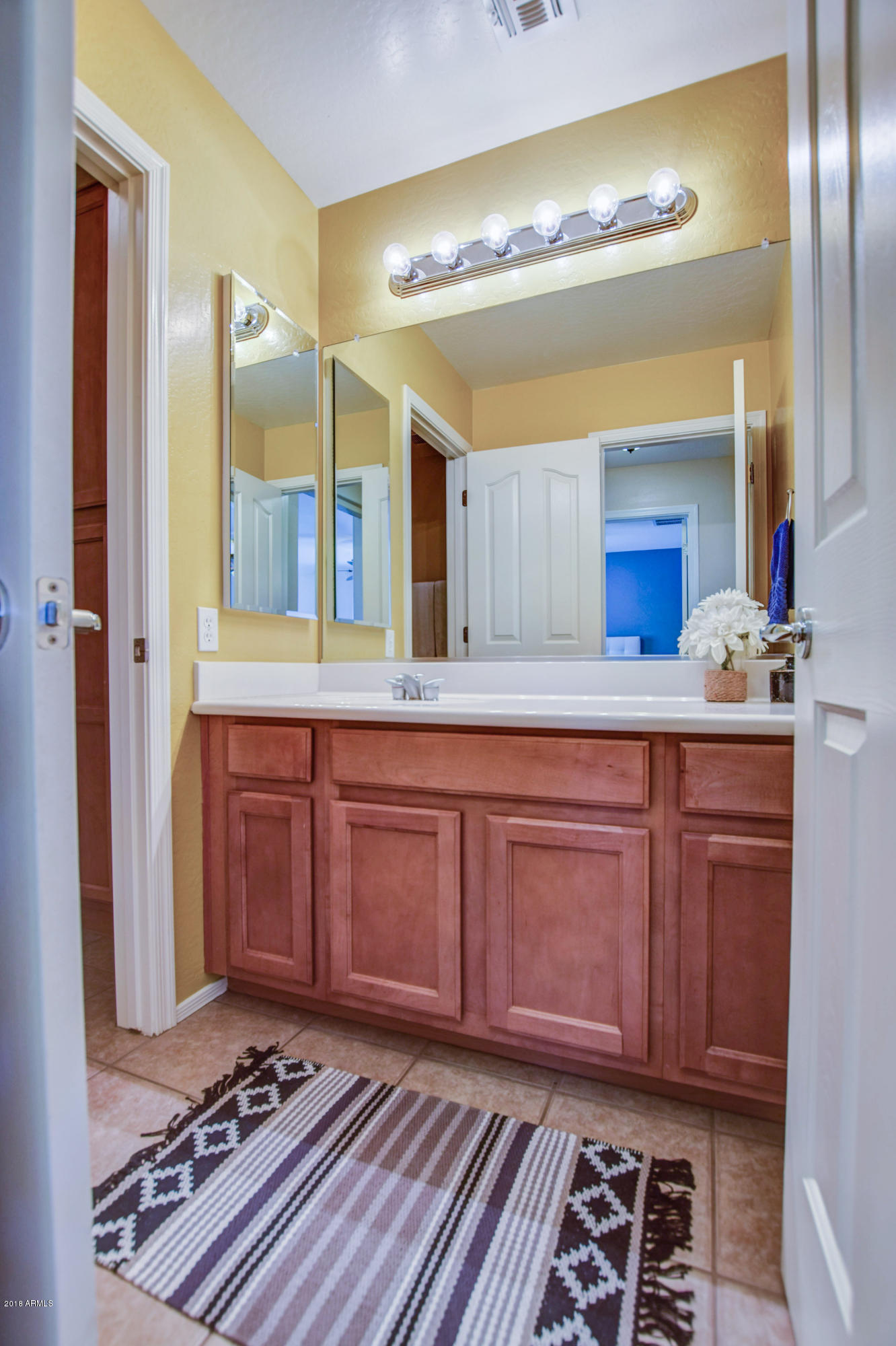 19702 East Thornton Road Queen Creek, AZ 85142 - Photo 50 of 79 a spacious bathroom with a sink and a mirror