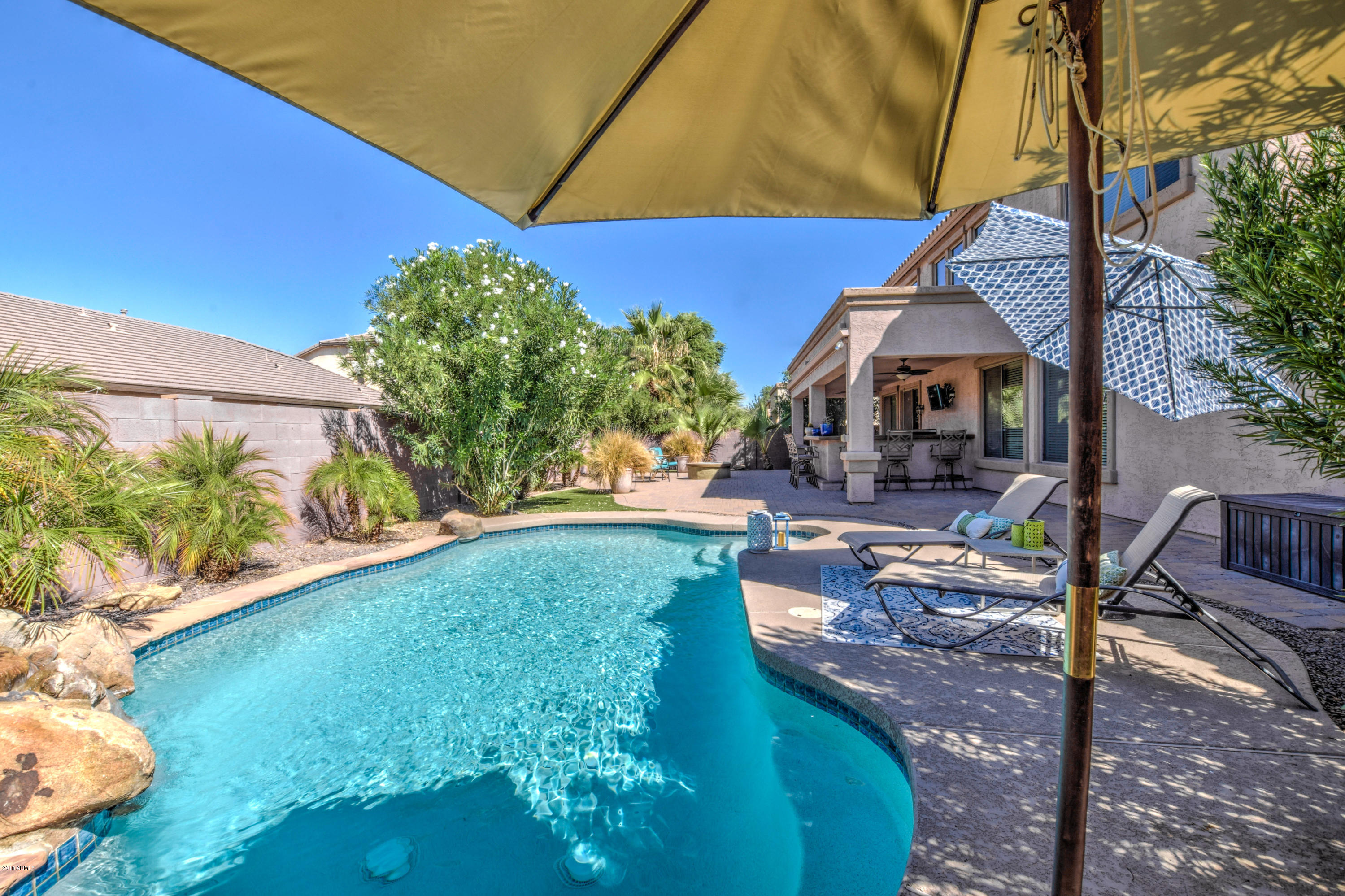 19702 East Thornton Road Queen Creek, AZ 85142 - Photo 53 of 79 a backyard of a house with lots of green space