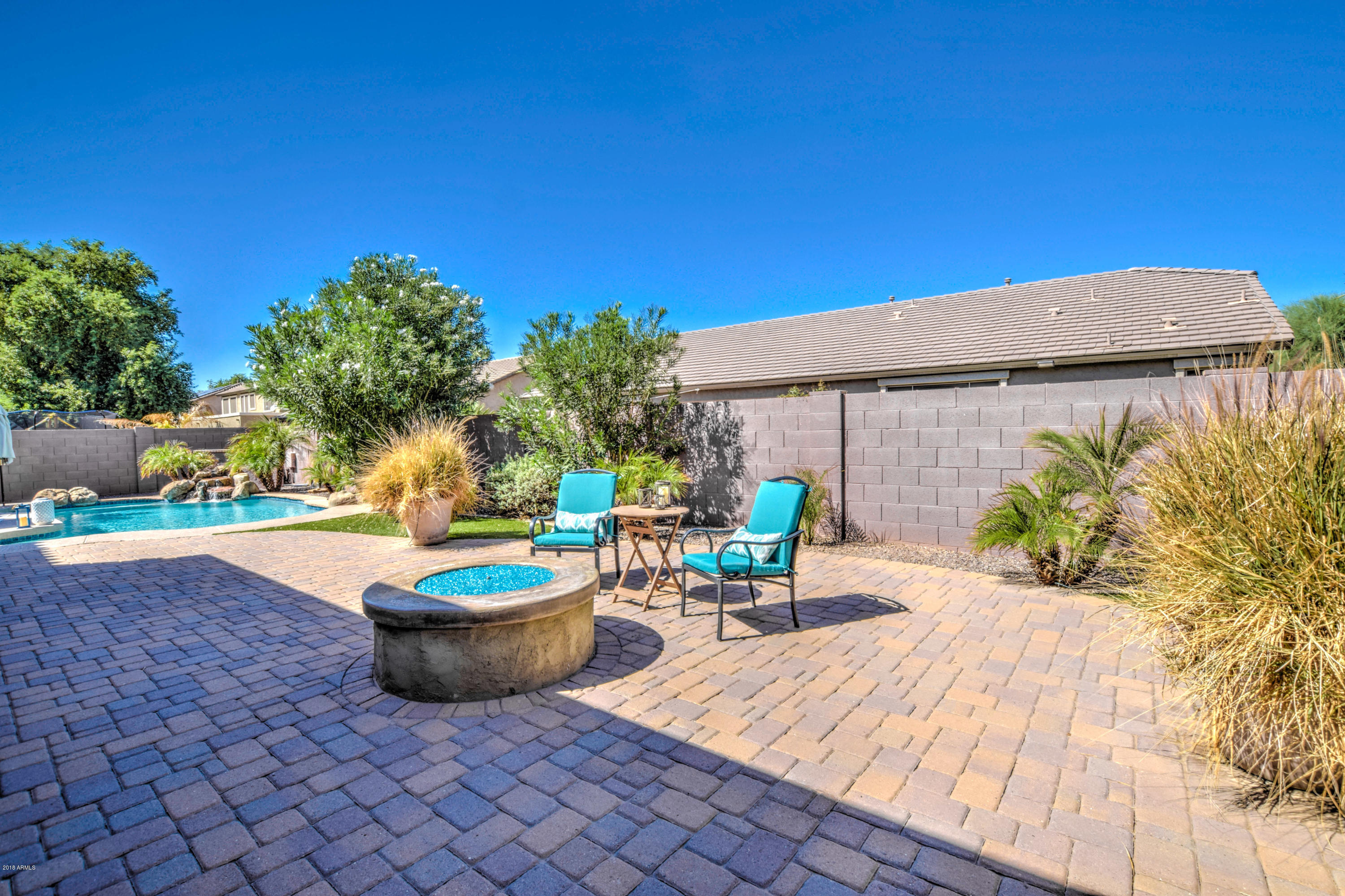19702 East Thornton Road Queen Creek, AZ 85142 - Photo 55 of 79 a backyard of a house with yard and outdoor seating