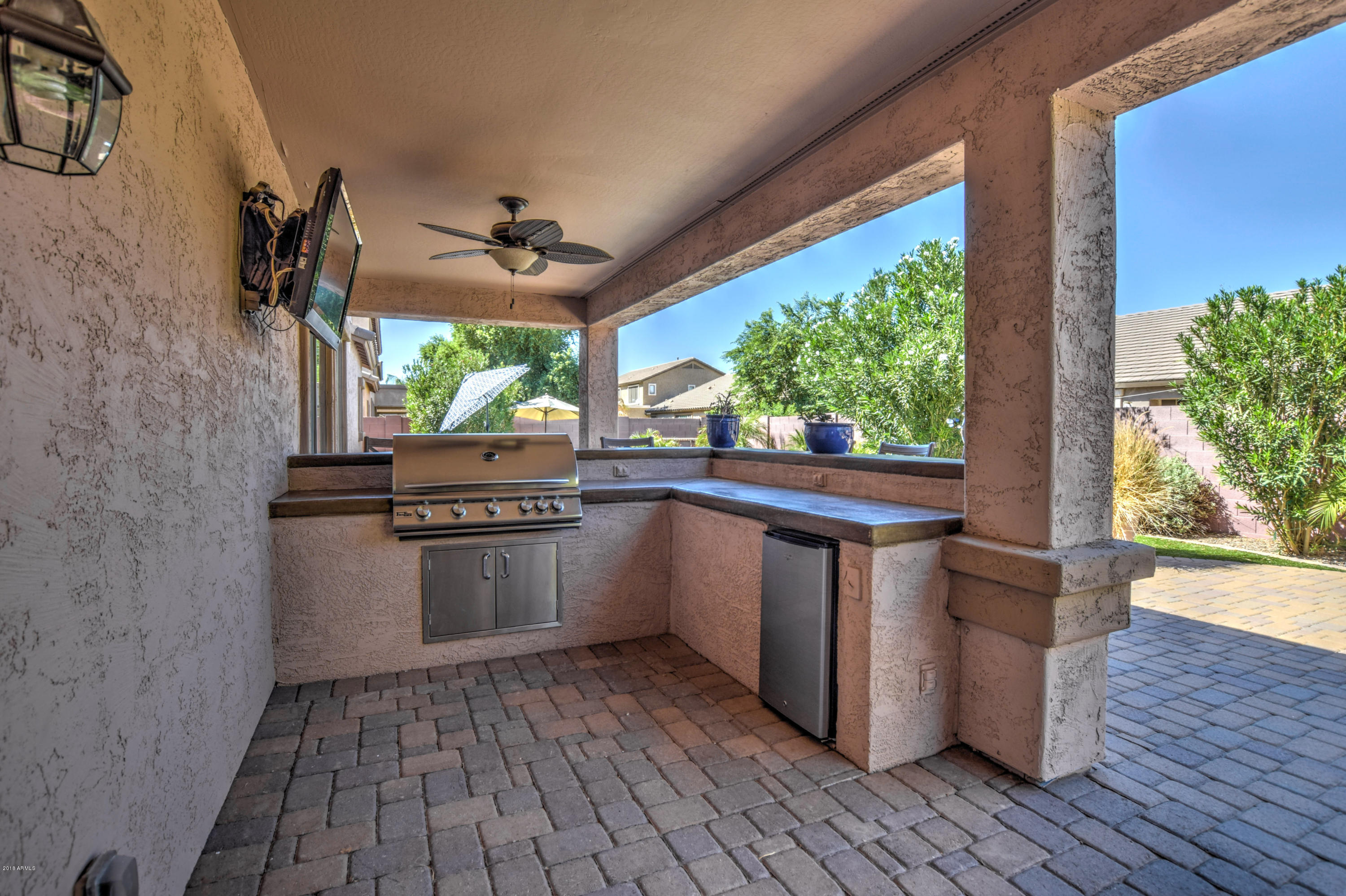 19702 East Thornton Road Queen Creek, AZ 85142 - Photo 61 of 79 a kitchen with stainless steel appliances granite countertop a stove a sink and a refrigerator