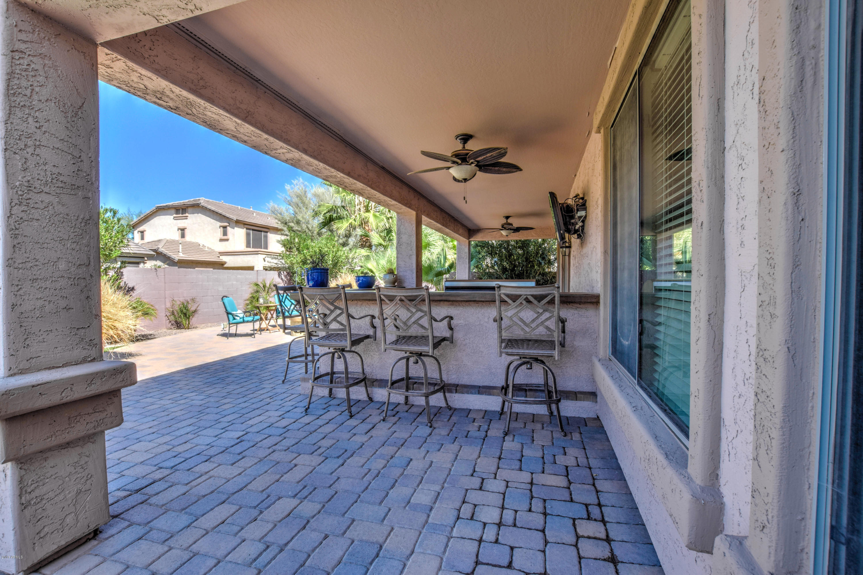19702 East Thornton Road Queen Creek, AZ 85142 - Photo 65 of 79 a view of a porch with furniture and a yard