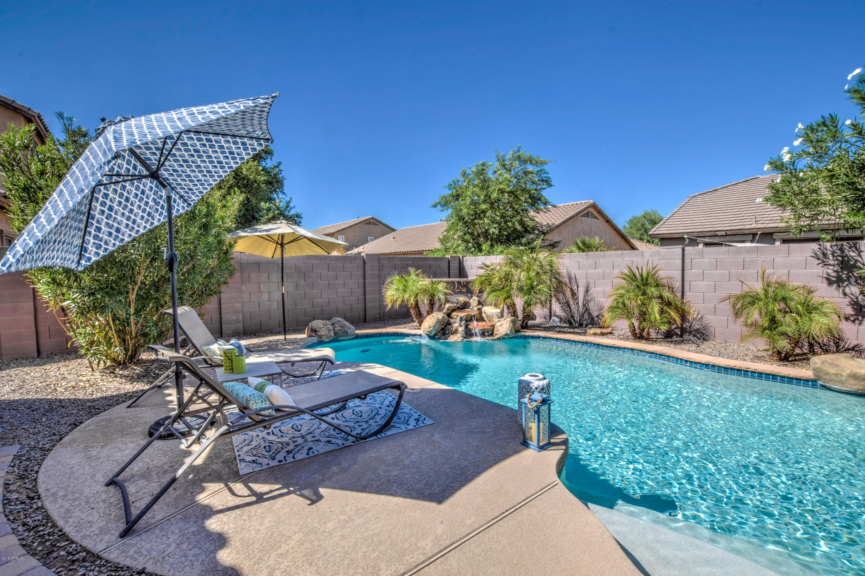 19702 East Thornton Road Queen Creek, AZ 85142 - Photo 66 of 79 a view of a backyard with table and chairs potted plants