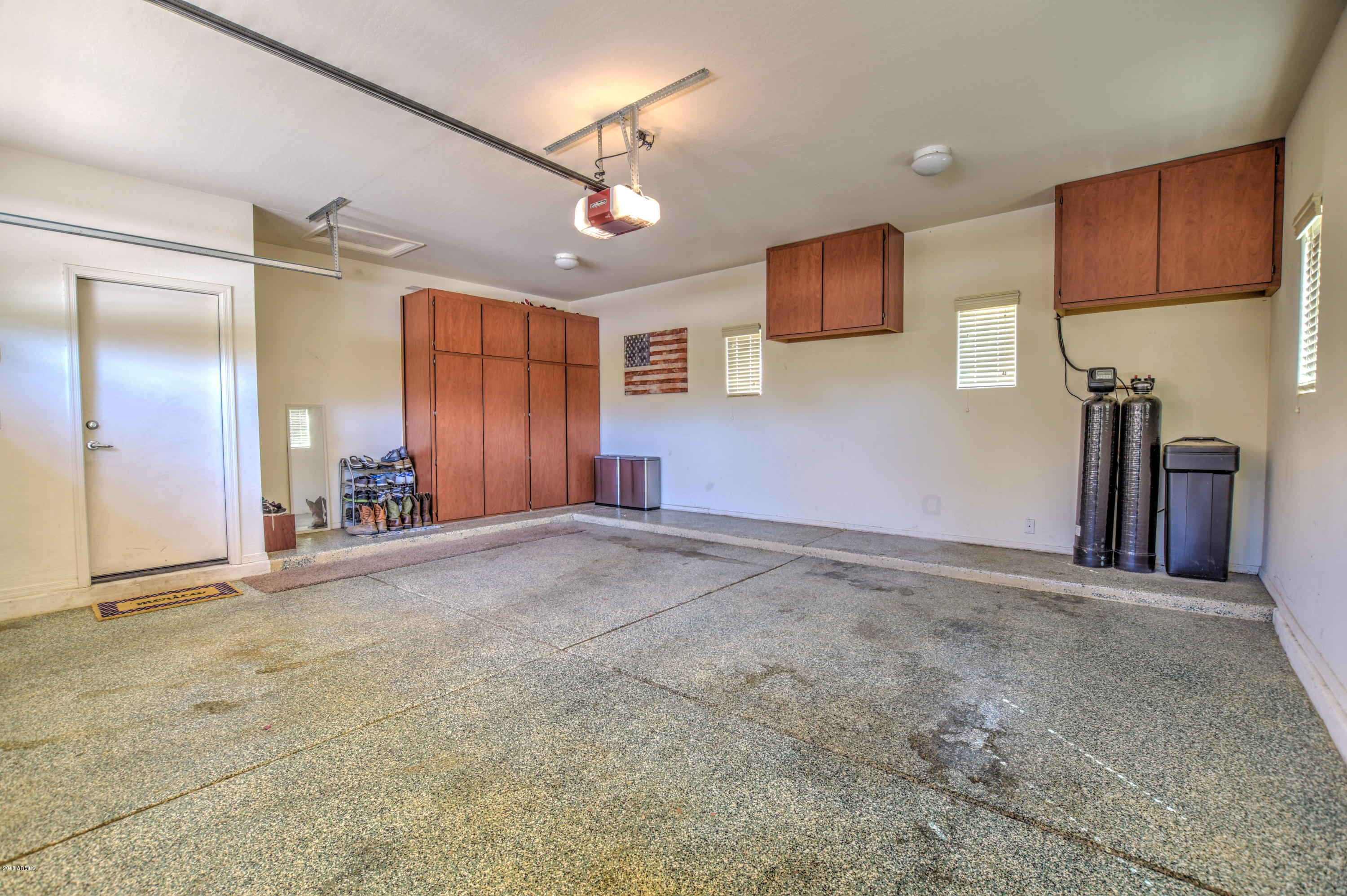 19702 East Thornton Road Queen Creek, AZ 85142 - Photo 77 of 79 a view of a livingroom with wooden floor and a ceiling fan