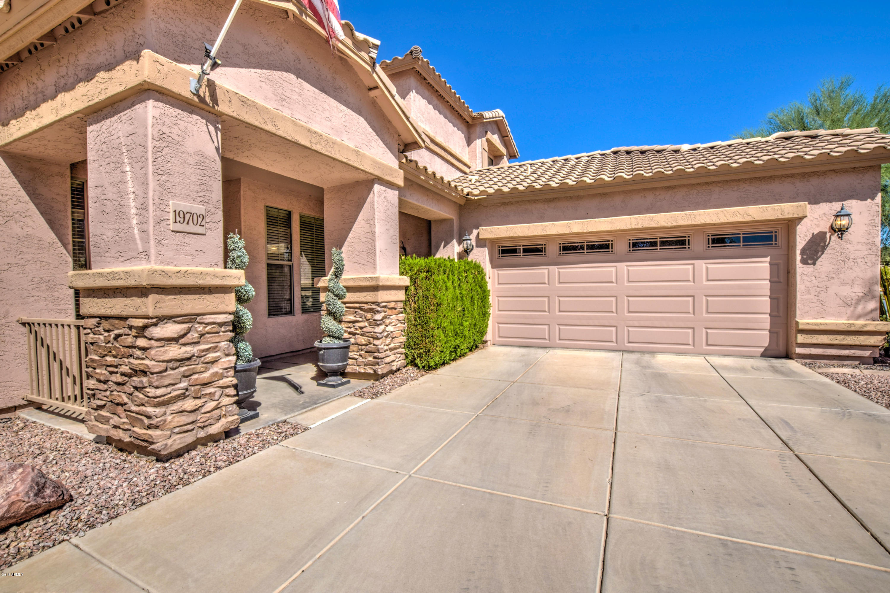 19702 East Thornton Road Queen Creek, AZ 85142 - Photo 78 of 79 a front view of a house with a garage