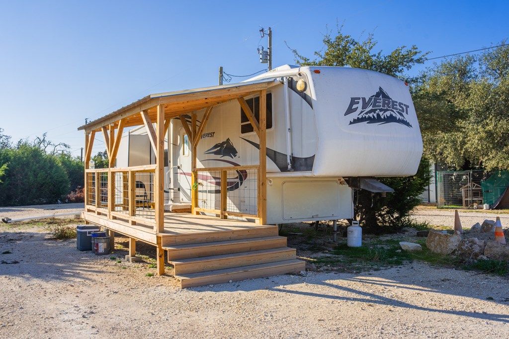 1031 Ranch To Market 479 Mountain Home, TX 78058 - Photo 16 of 22 a front view of a house with a yard