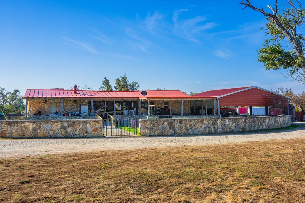 1031 Ranch To Market 479 Mountain Home, TX 78058 - Photo 5 of 22 a view of swimming pool with outdoor seating and a yard