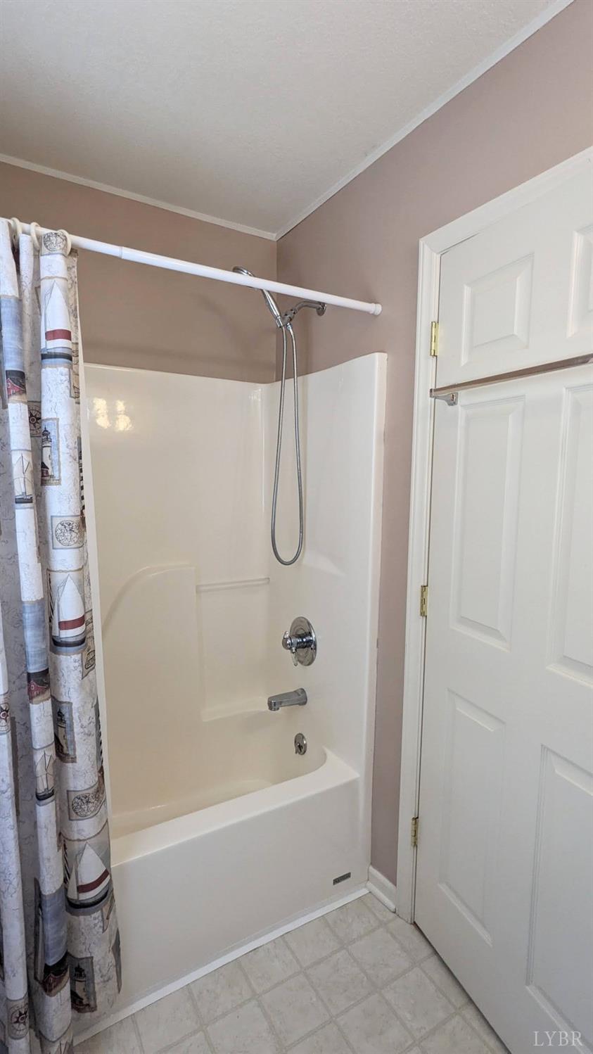 3959 Diamond Hill Road Moneta, VA 24121 - Photo 27 of 50 a bathroom with a shower and a bath tub