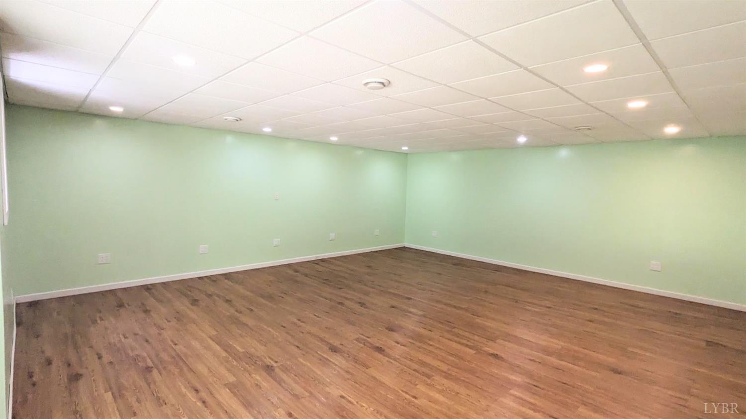3959 Diamond Hill Road Moneta, VA 24121 - Photo 31 of 50 an empty room with wooden floor