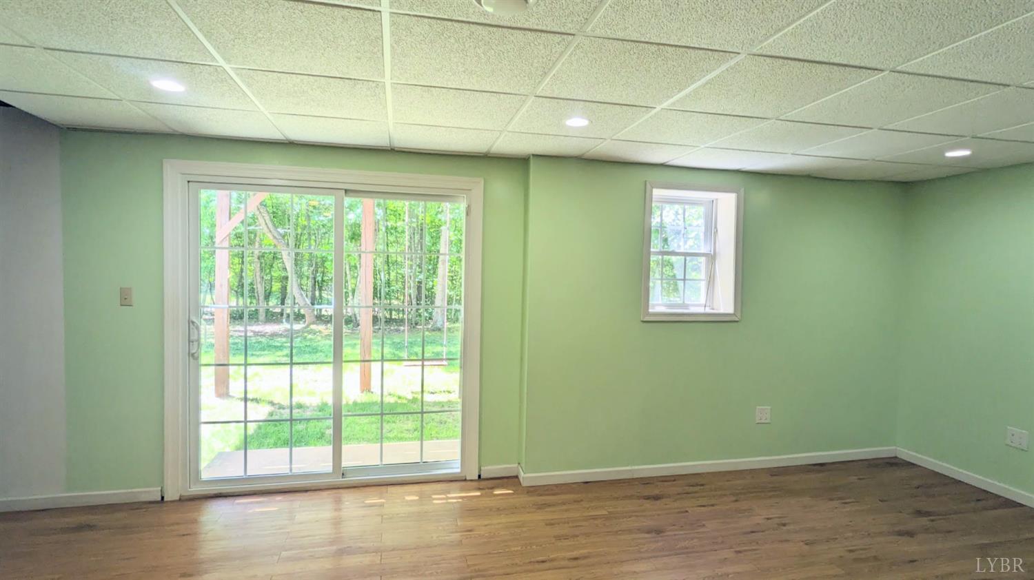 3959 Diamond Hill Road Moneta, VA 24121 - Photo 32 of 50 a view of empty room with wooden floor and fan
