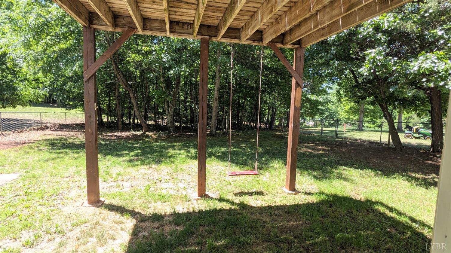 3959 Diamond Hill Road Moneta, VA 24121 - Photo 34 of 50 a view of a yard with a tree and a porch