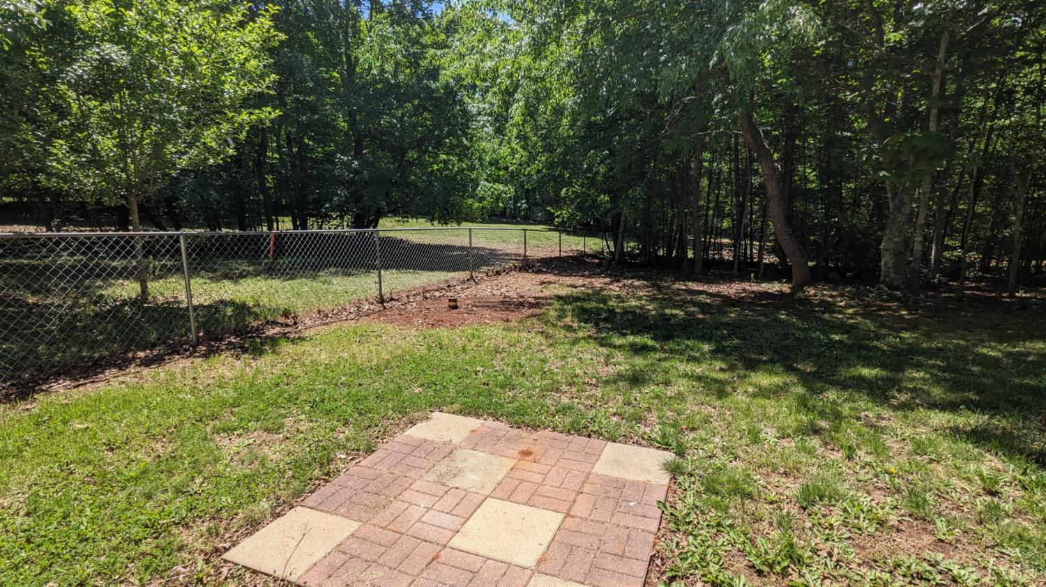 3959 Diamond Hill Road Moneta, VA 24121 - Photo 37 of 50 a backyard of a house with lots of green space