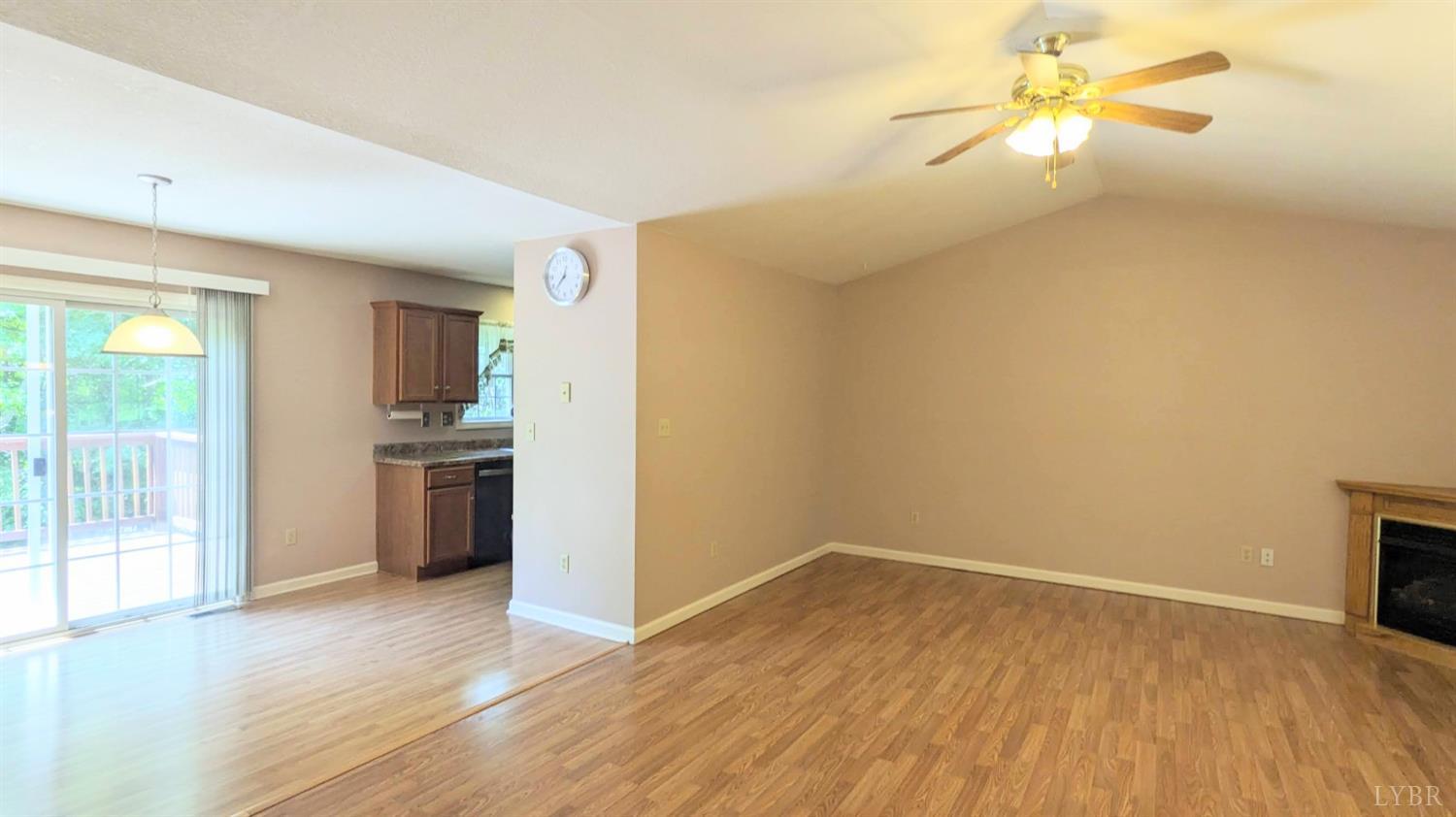 3959 Diamond Hill Road Moneta, VA 24121 - Photo 10 of 50 a view of a room with wooden floor and a ceiling fan