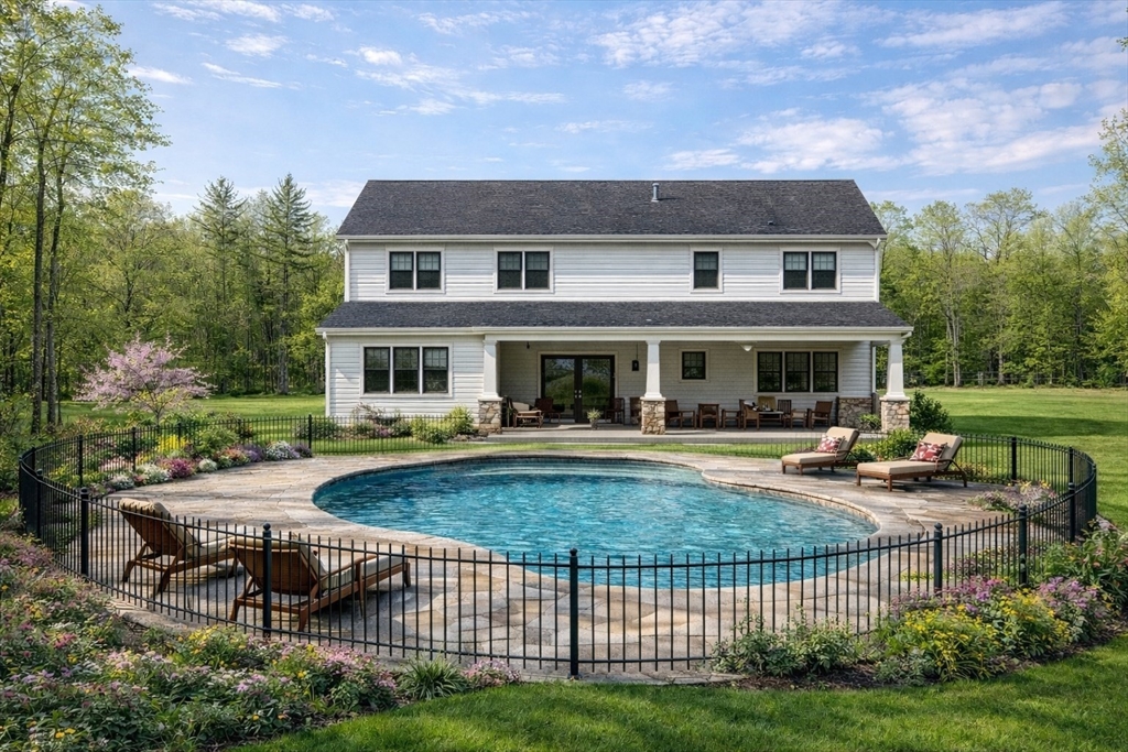 7 Quigley Road Southampton, MA 01073 - Photo 27 of 30 a view of a house with backyard sitting area and garden