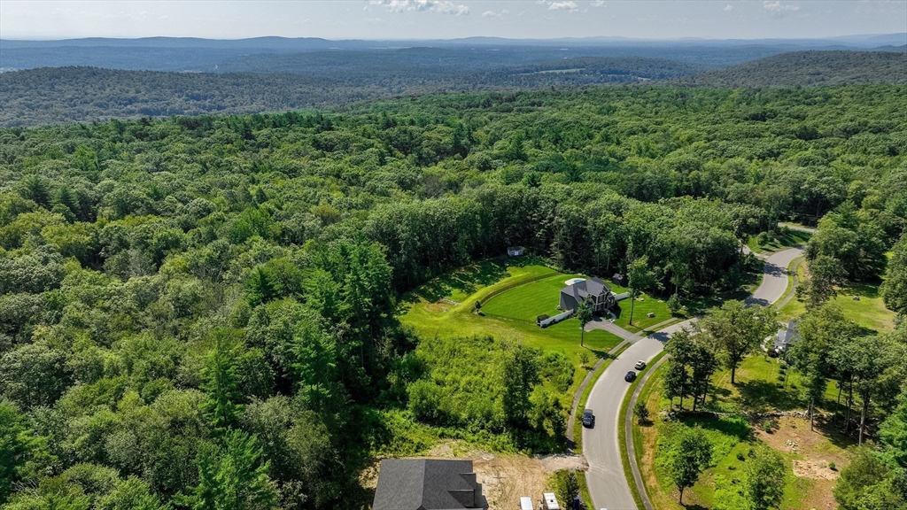 7 Quigley Road Southampton, MA 01073 - Photo 8 of 33 a view of a houses with a lush green forest