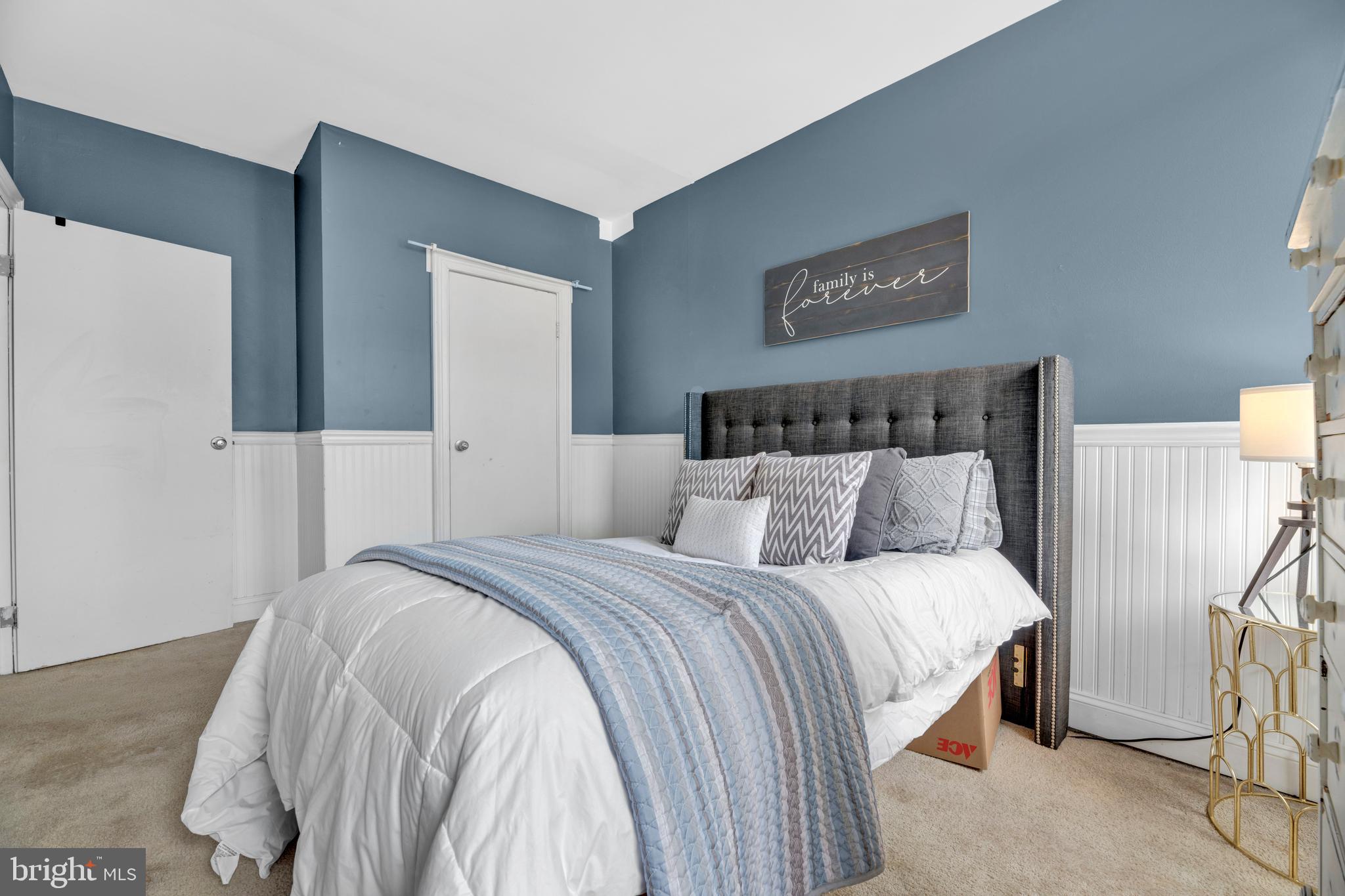 1436 W Street Northwest, Unit 405 Washington, DC 20009 - Photo 13 of 13 a bedroom with a bed and a night stand