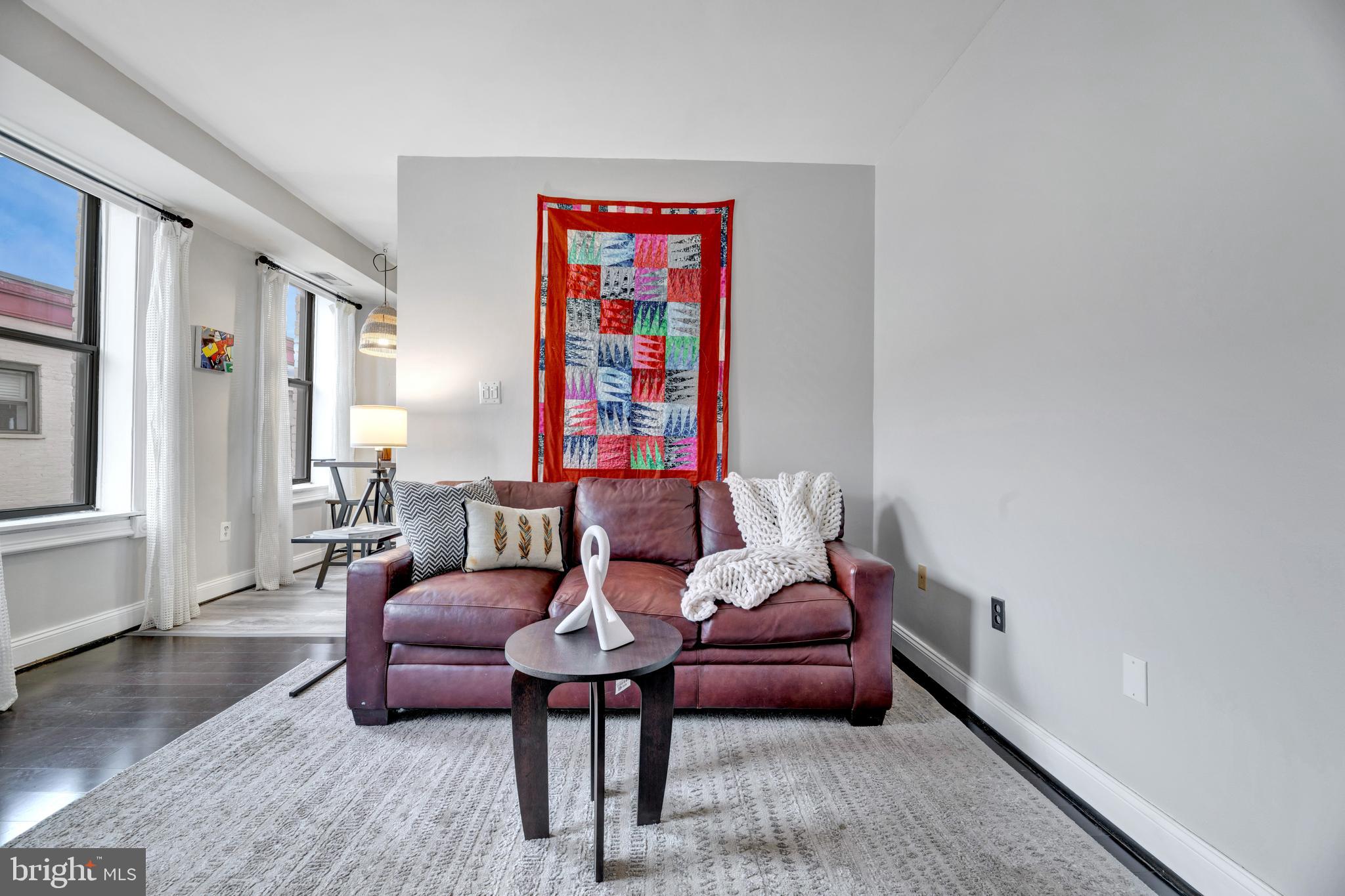 1436 W Street Northwest, Unit 405 Washington, DC 20009 - Photo 2 of 13 a living room with furniture and a window