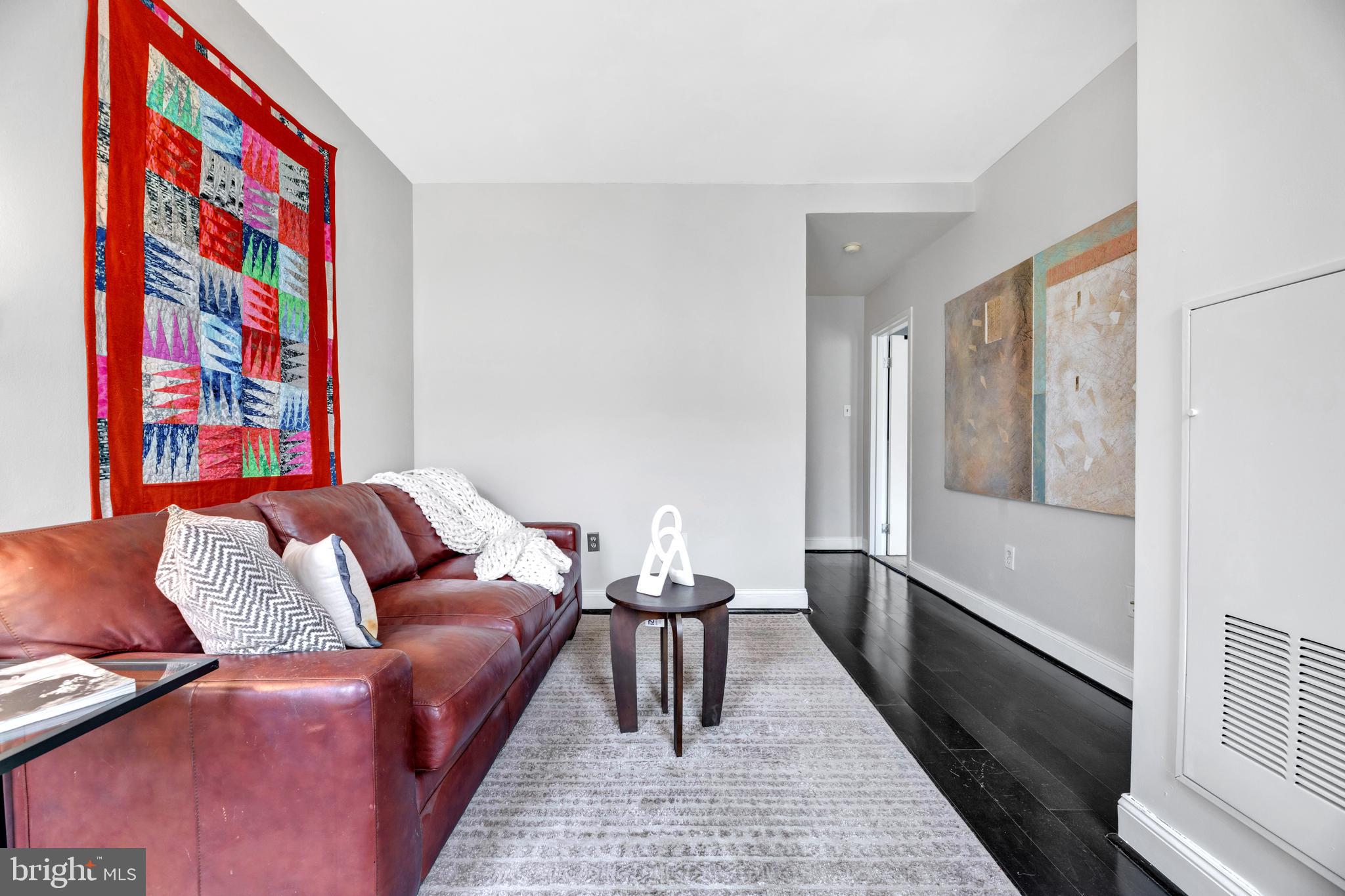 1436 W Street Northwest, Unit 405 Washington, DC 20009 - Photo 3 of 13 a living room with furniture and a couch
