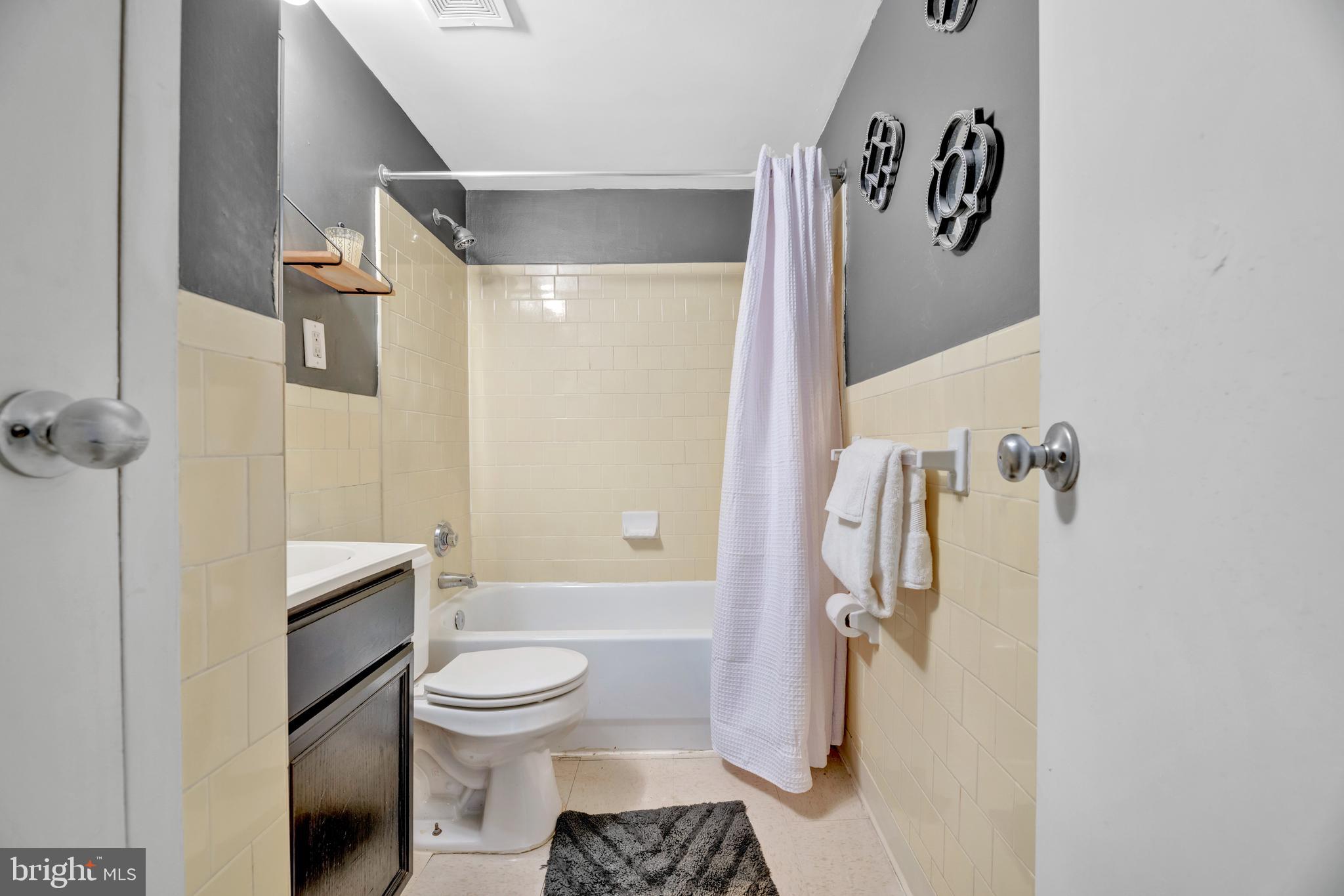 1436 W Street Northwest, Unit 405 Washington, DC 20009 - Photo 10 of 13 a bathroom with a toilet and a shower